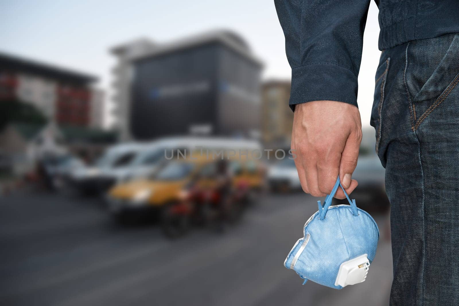 A man in the city with medical mask to protect against viruses. Closeup photo. Coronavirus pneumonia or flu concept