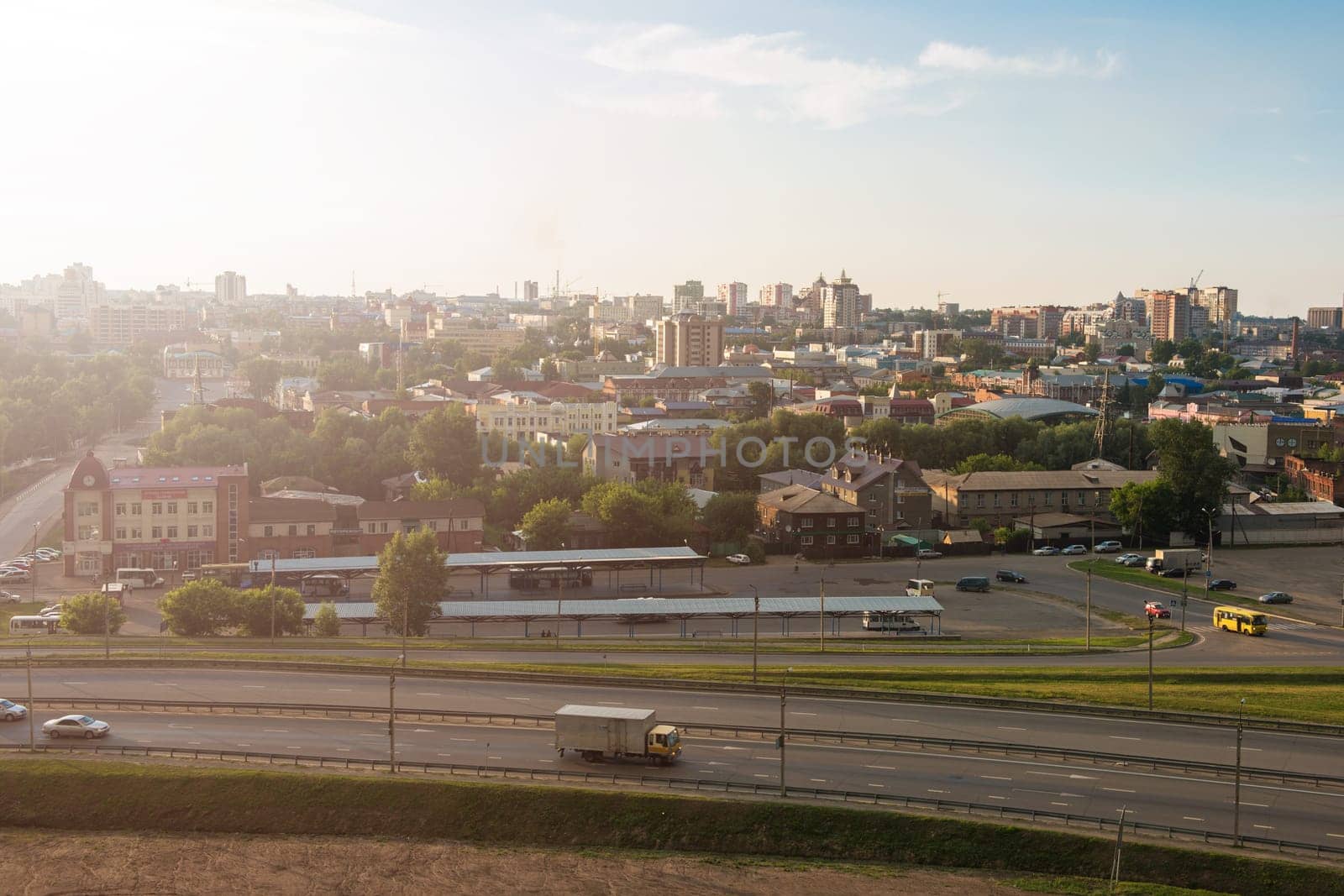 Panoramic picture of road and cars driving, summer sunny day in Barnaul, Siberia, Russia