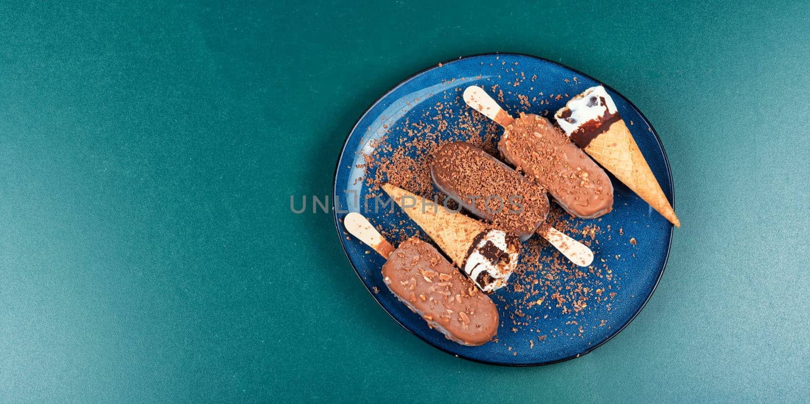 Chocolate ice cream on stick. Eskimo on stick ice cream in chocolate glaze with nuts. Close up.