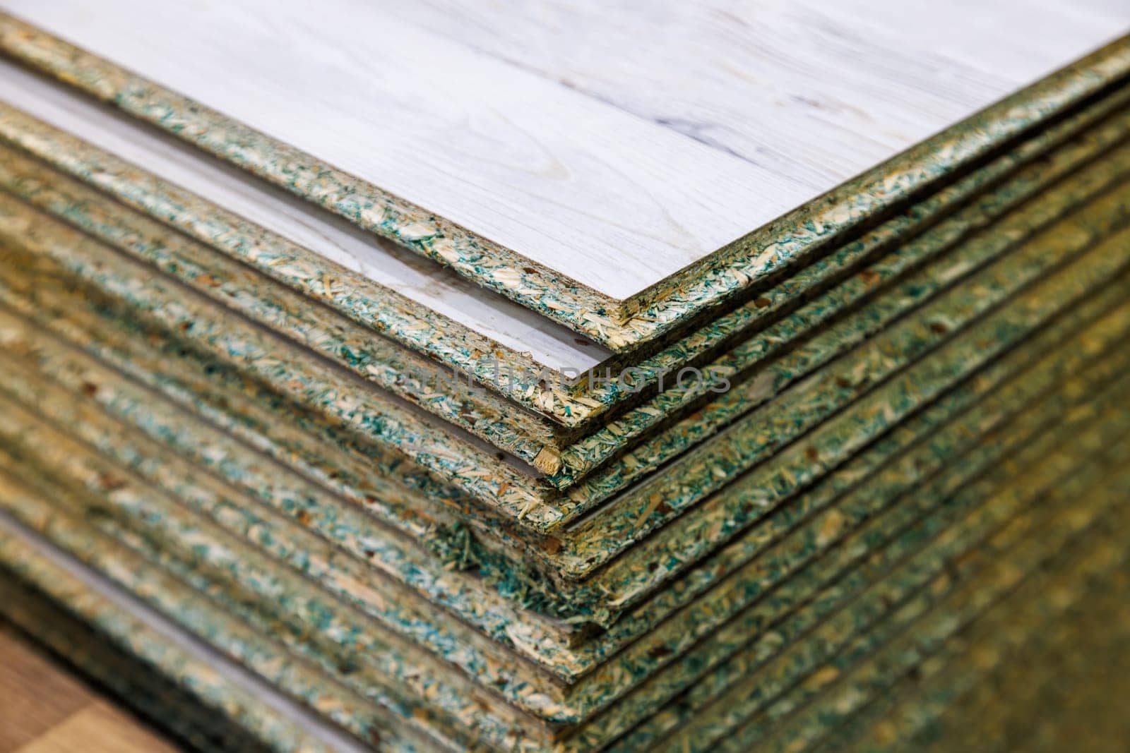 stacks of tongue and groove water resistant OSB compressed sawdust sheets.