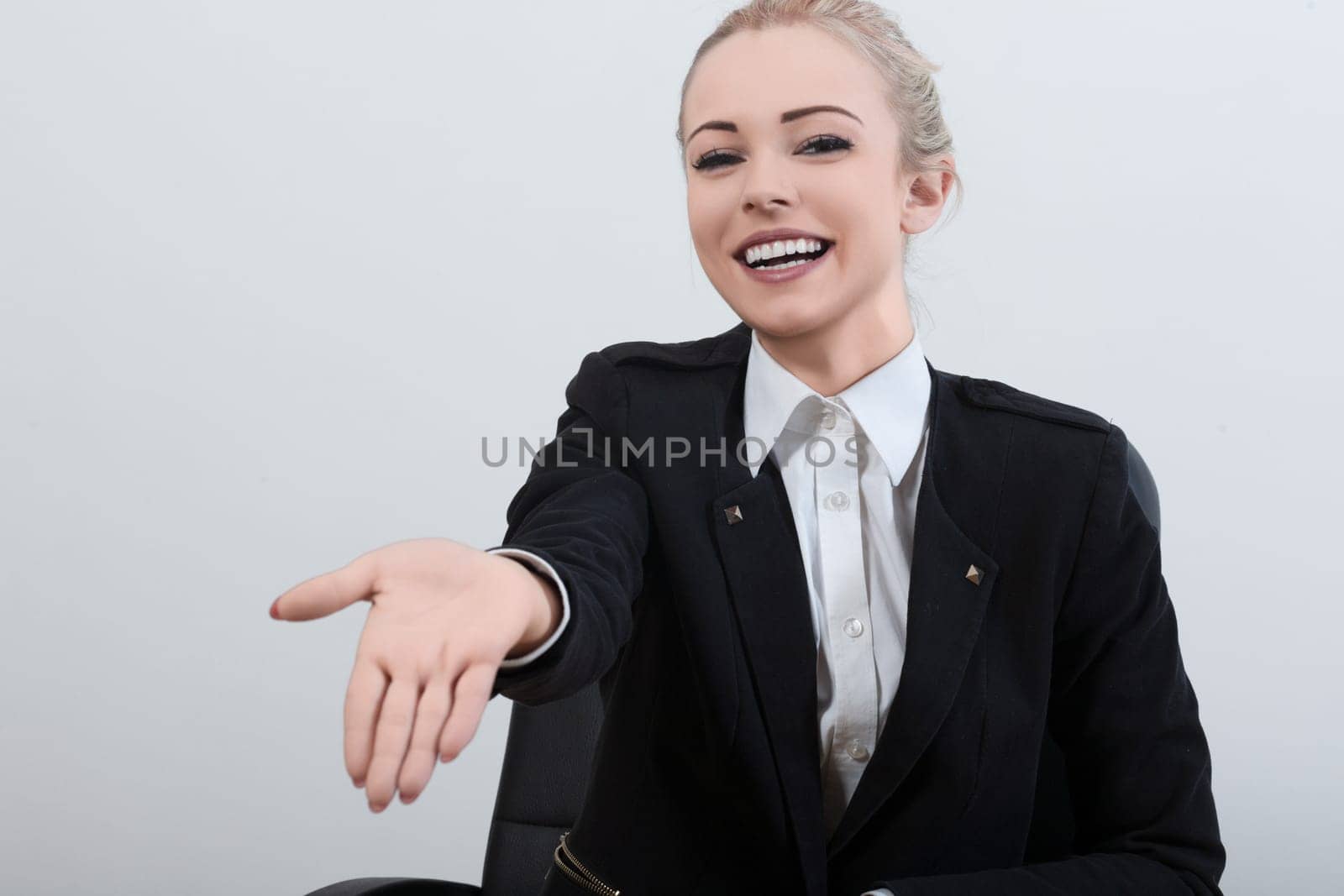 With a polite smile, the female officer in a black uniform requests the mandatory documents. Her kind expression does not diminish the assertiveness and decisiveness in her approach