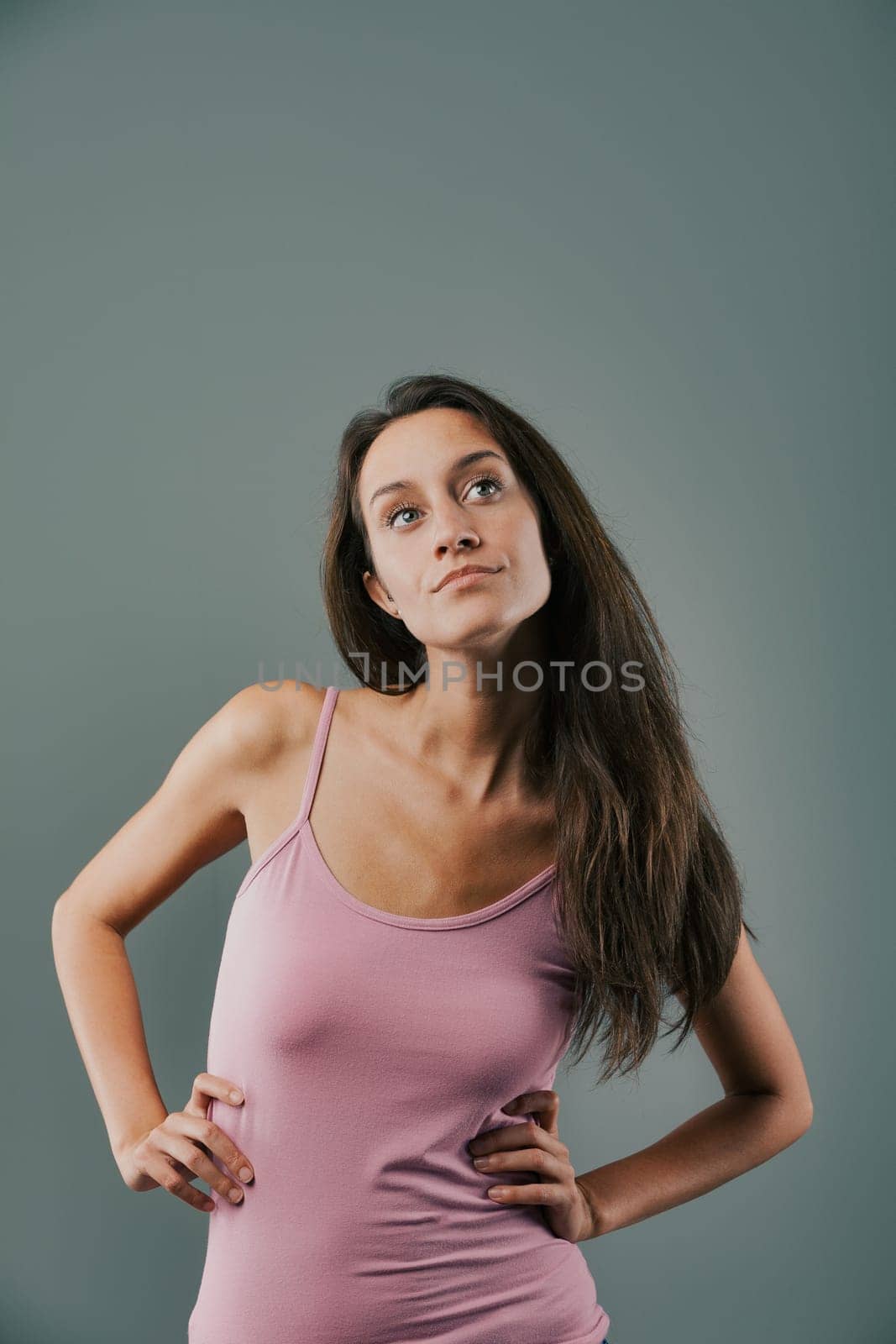 Woman in a pink shirt looking at the camera
