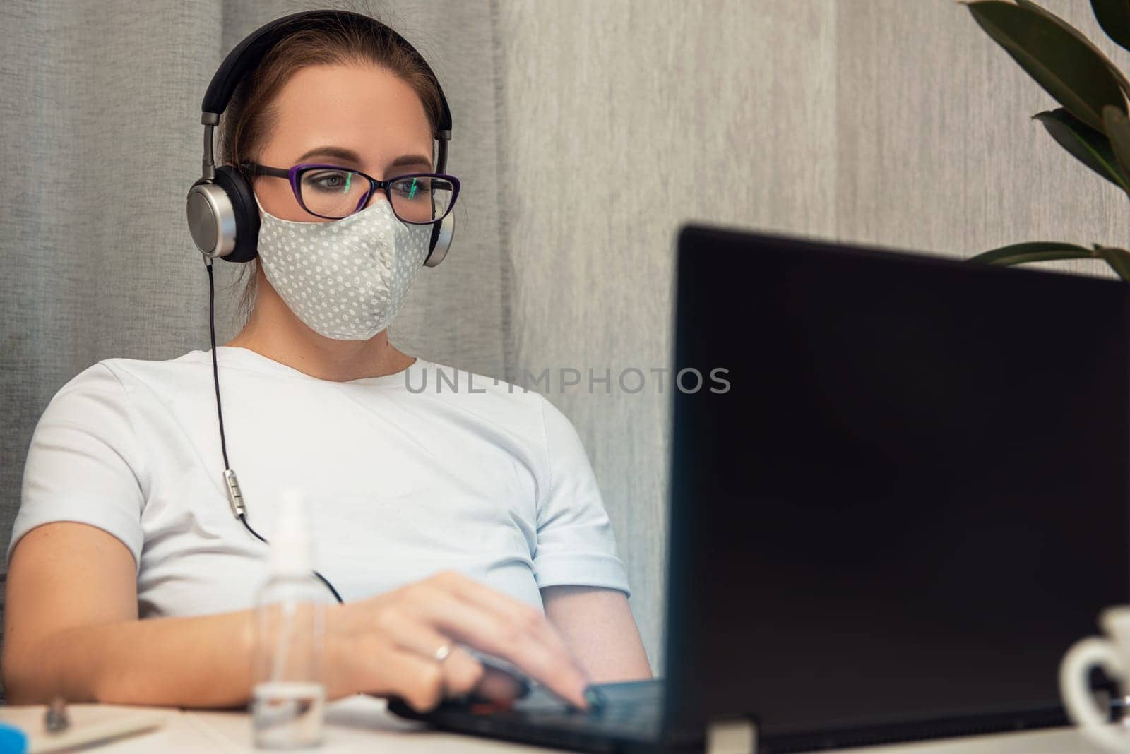 Coronavirus concept. Woman in quarantine for coronavirus working from home