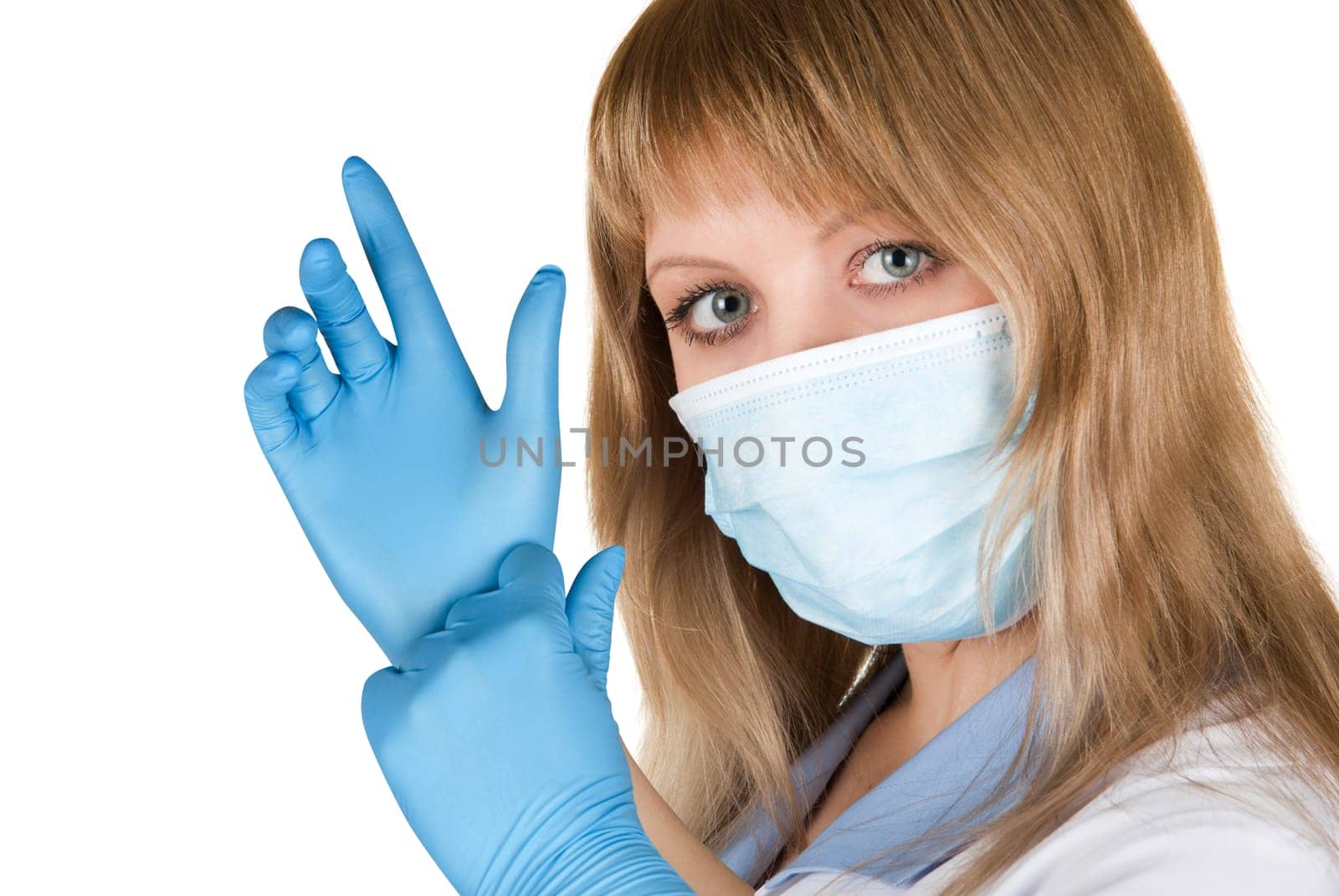 Closeup of a doctor wearing a protection mask and gloves on white
