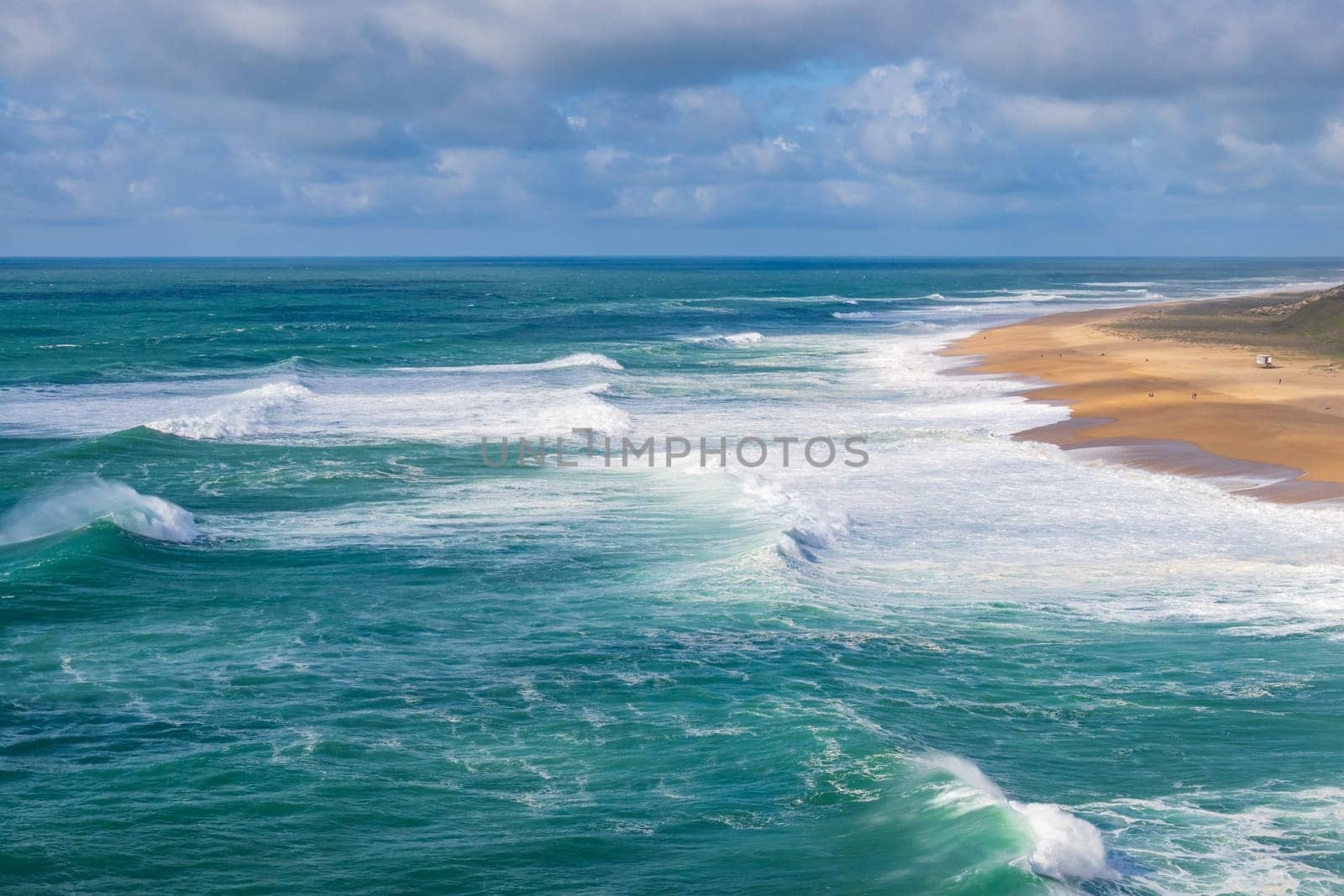 Nazare 's North beach (Praia do Norte, Nazare). World record of biggest wave. Beach with rough sea.