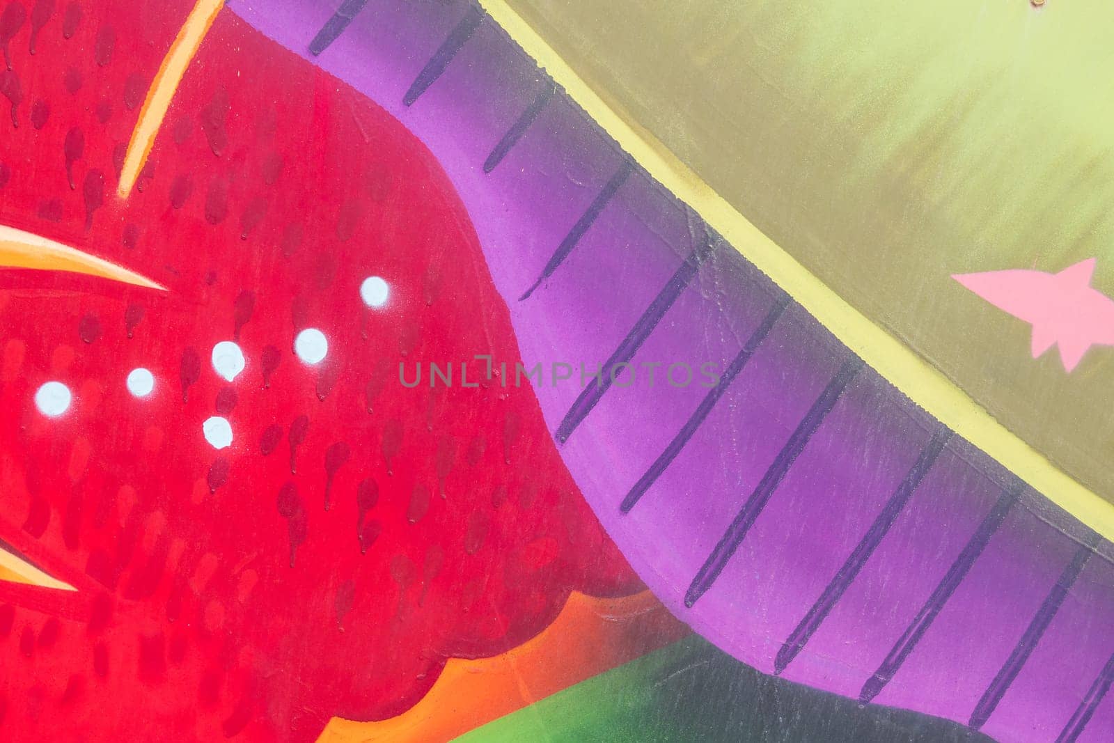 Abstract detail of color graffiti painted on the wall