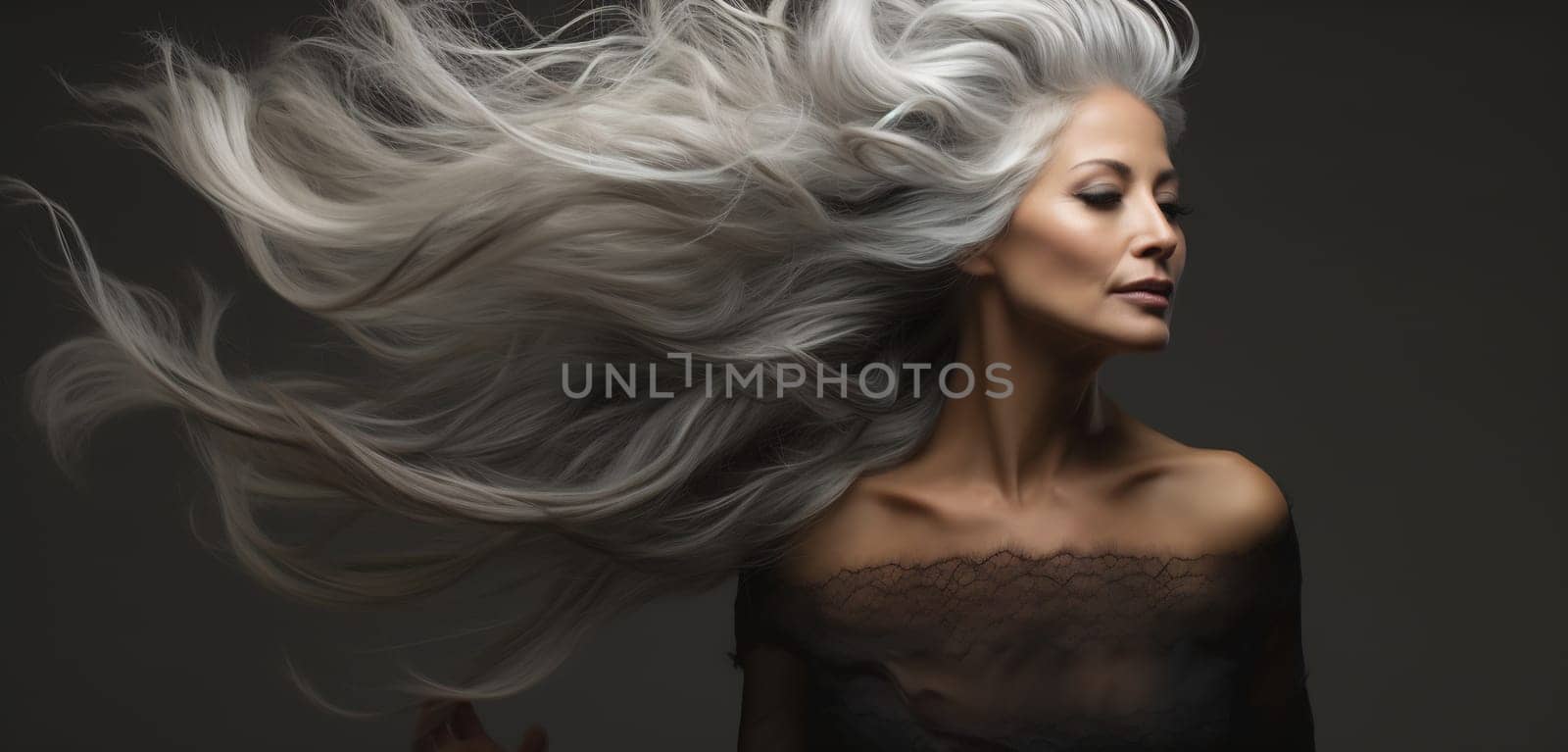 Dramatic image of a woman with swirling silver hair and a gaze that captivates.