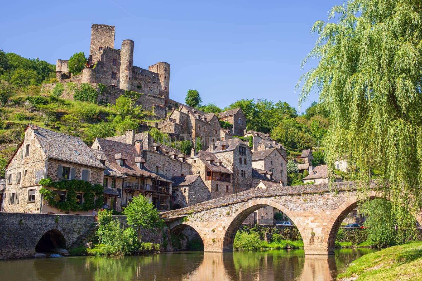 Belcastel village, castle and medieval bridge over Aveyron river, one of the most beautiful villages of France photographed in Occitanie region