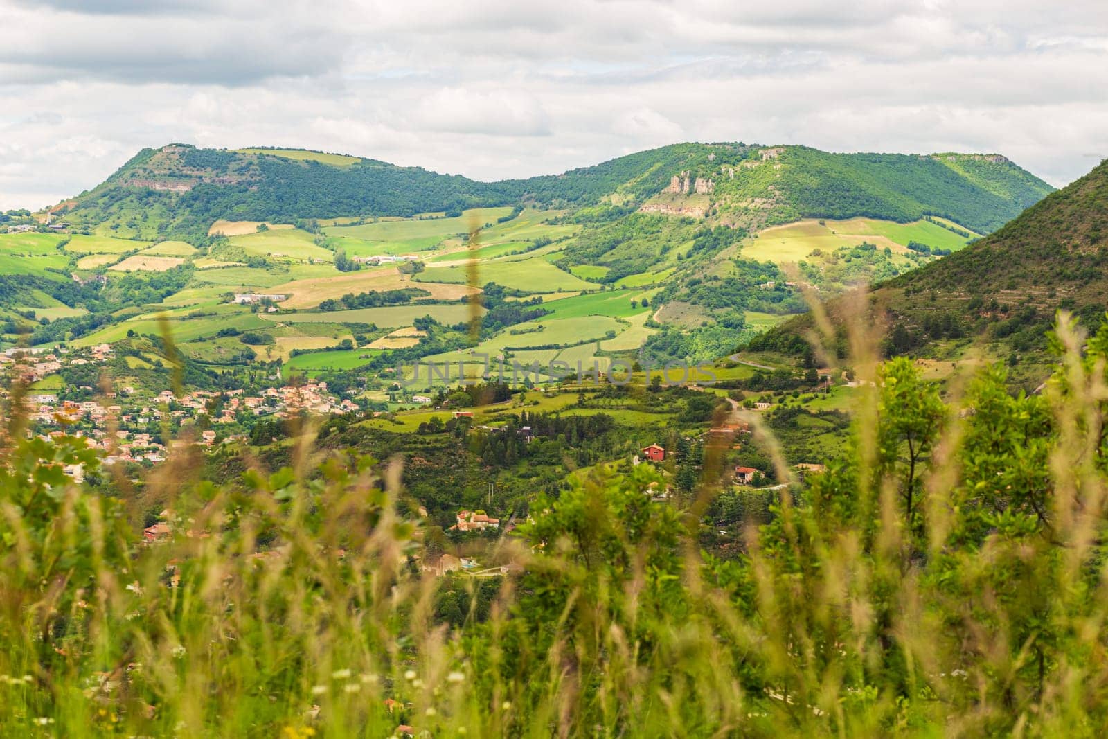 View over Millau town with Causse du Larzac limestone plateau, listed as UNESCO World Heritage Site. Department of Aveyron, France