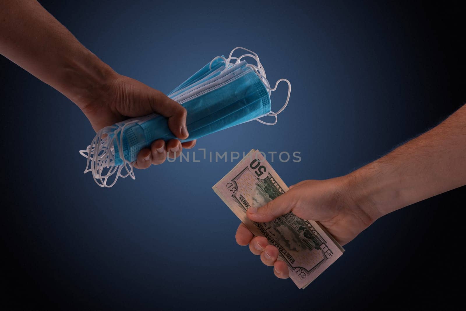 Sell - buy medical face mask concept. Hands holding protective face masks and nany US dollars banknote a lot of at.