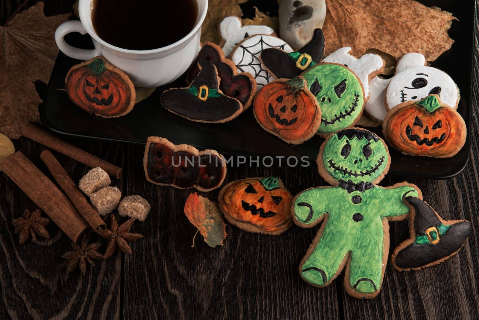Ginger biscuits for Halloween holiday on wooden table with copy space