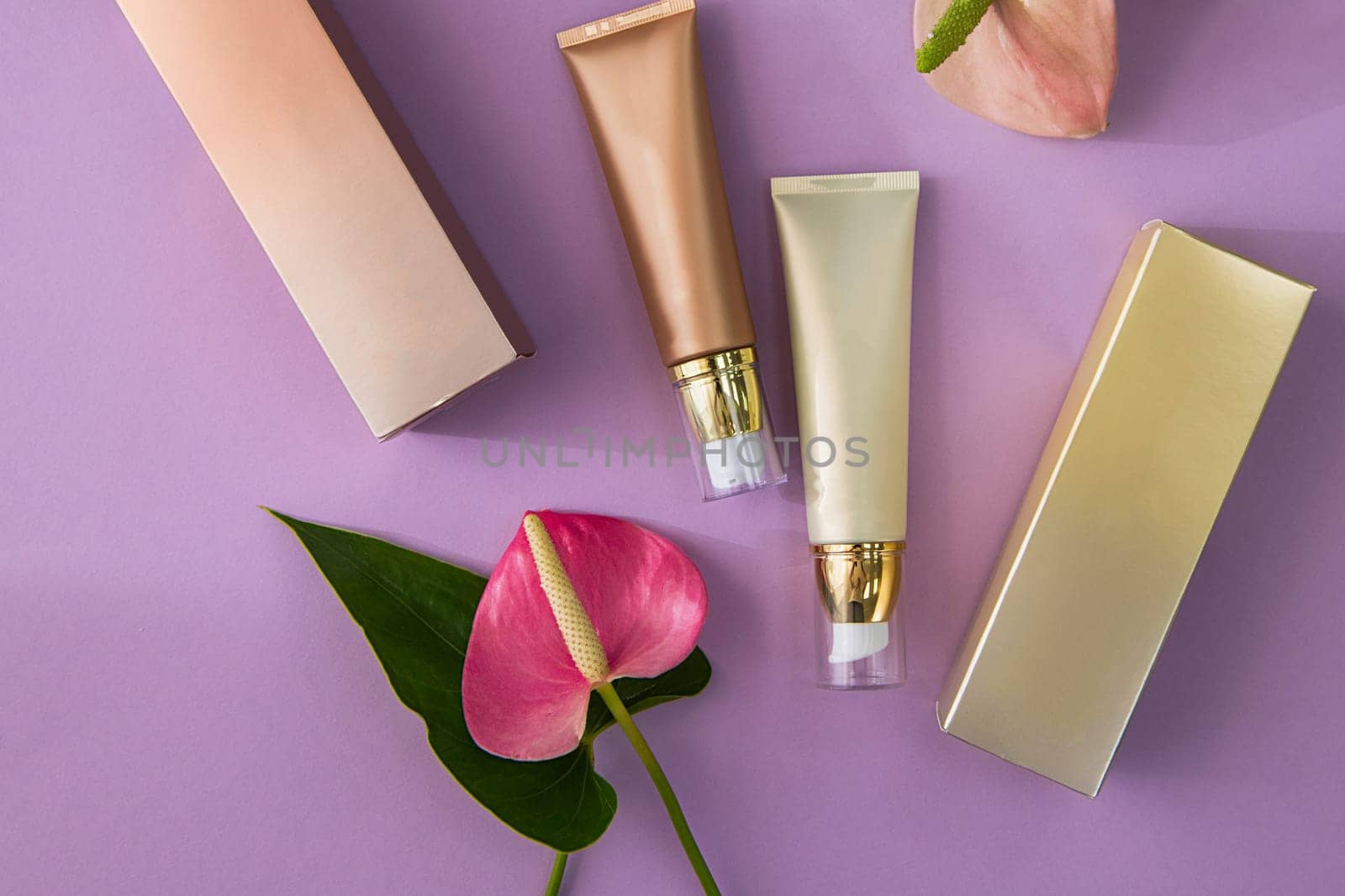 Makeup cosmetic products on vivid color background, flat lay top view.