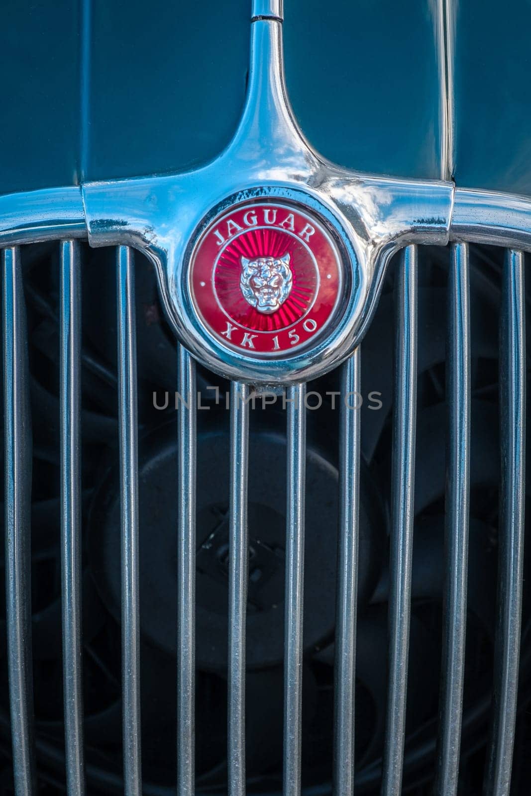Lisbon, Portugal - Jan 20, 2024: Car design detail of Jaguar logo or brand name and chrome grille close-up