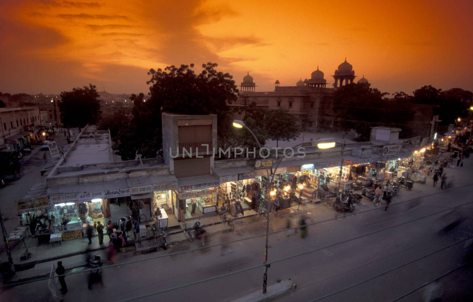 a Road with Hauses and Shops in the evening in the Town of Udaipur in the Province of Rajasthan in India.  India, Udaipur, January, 1998