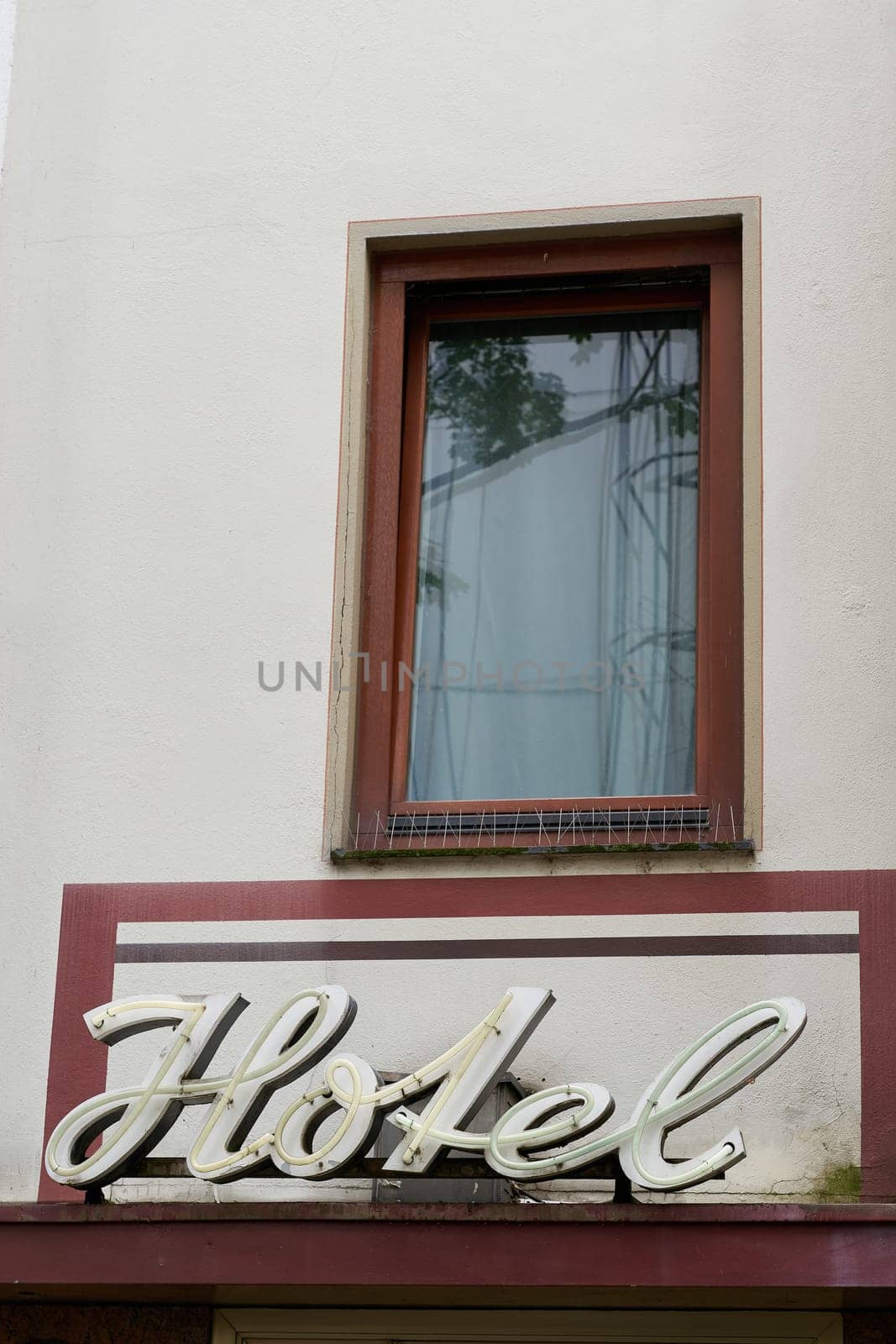 Illuminated sign for a hotel in the old town of Cologne in Germany