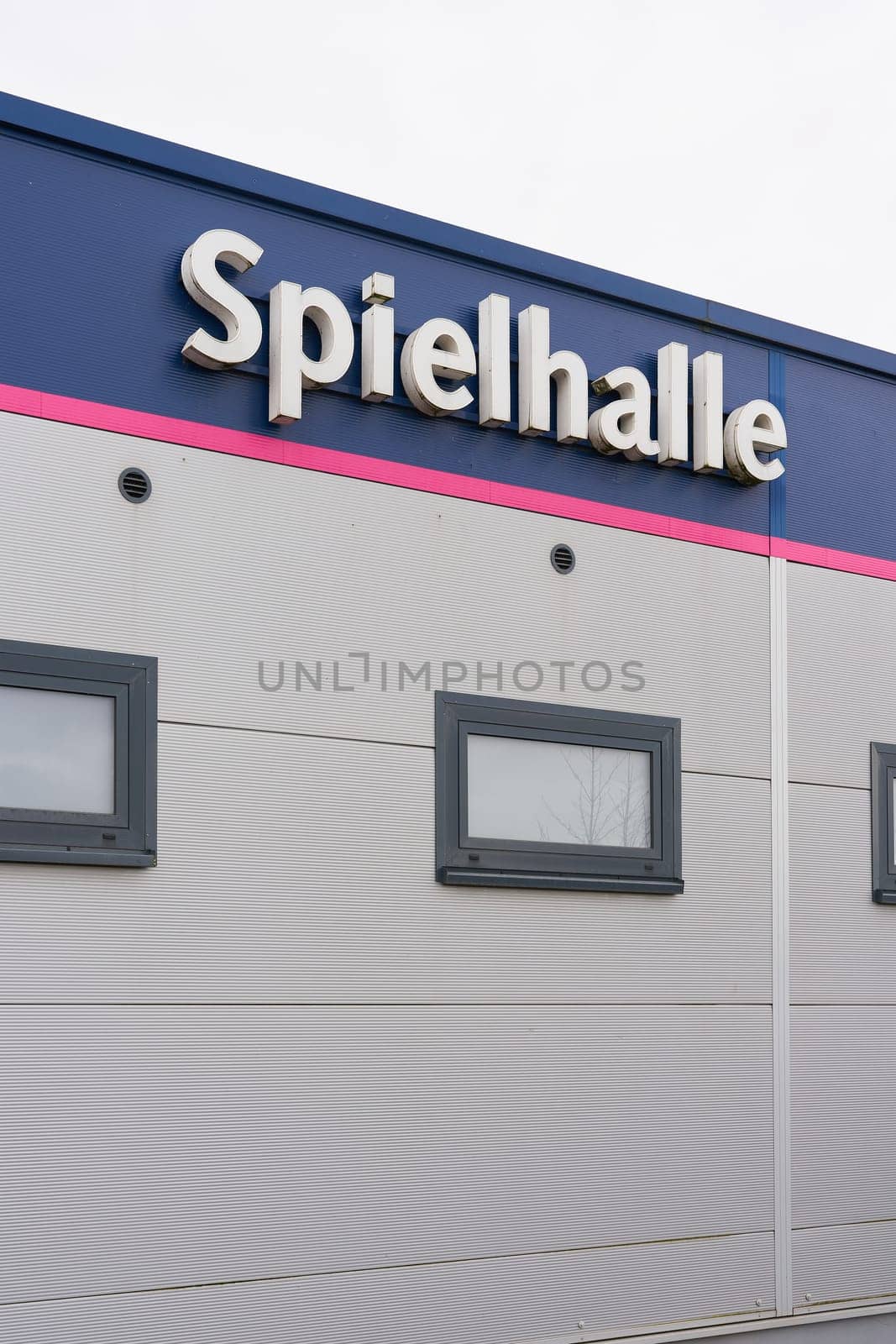 German lettering Spiellhalle on a facade of a amusement arcade. Translation: amusement arcade