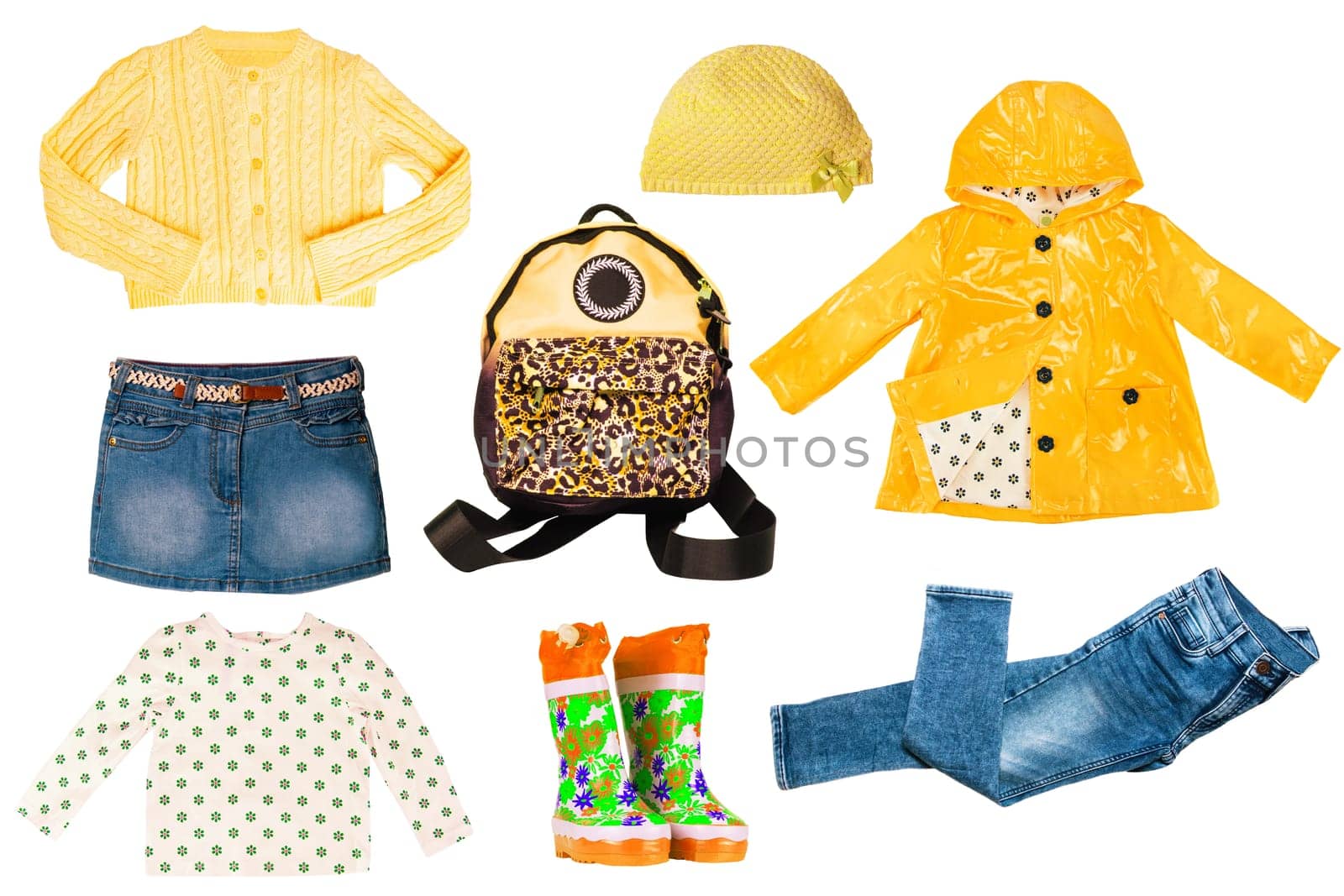 Collage set of little girl autumn clothes isolated on white. Kids apparel collection. Childs fashion clothing outfit. Jeans, skirt, shorts, shirts, jacket, boots, bag and shoes.