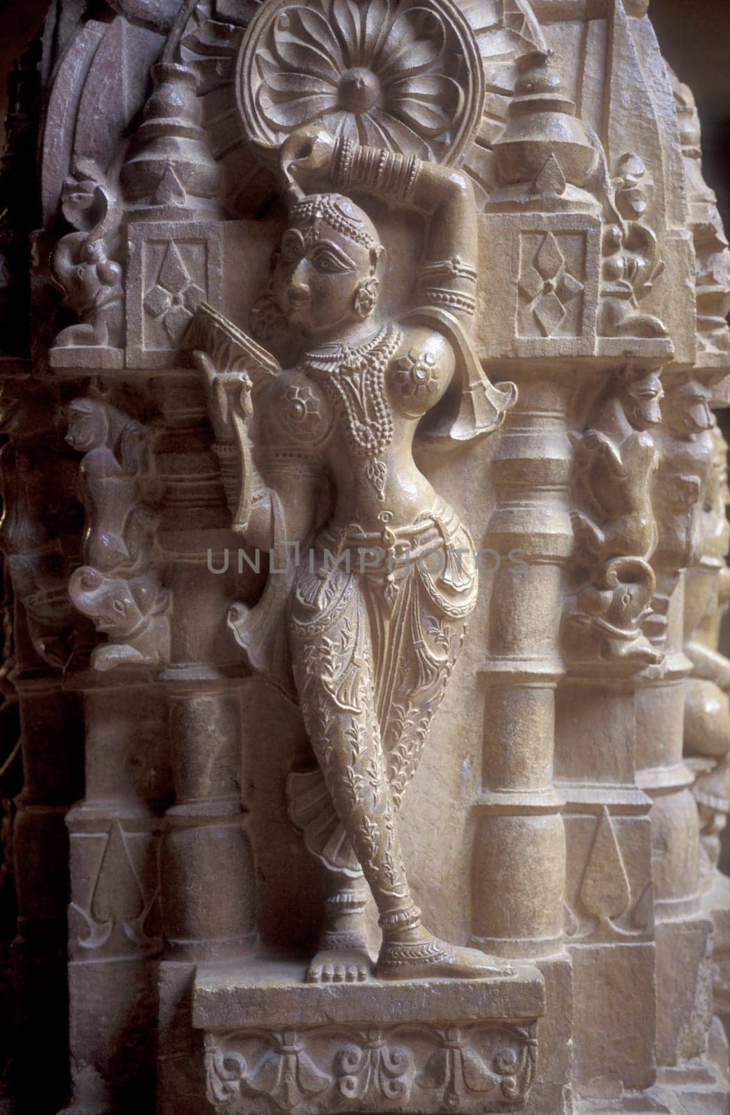 a stone Figure inside oft the Jain Temple in the Jaisalmer Fort in the city of Jaisalmer in the Province of Rajasthan in India.  India, Jaisalmer, January, 1998