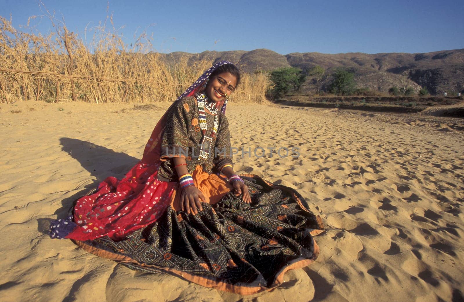 a portrait of a Rajasthani women in the Town of Jaisalmer in the Province of Rajasthan in India.  India, Jaisalmer, January, 1998