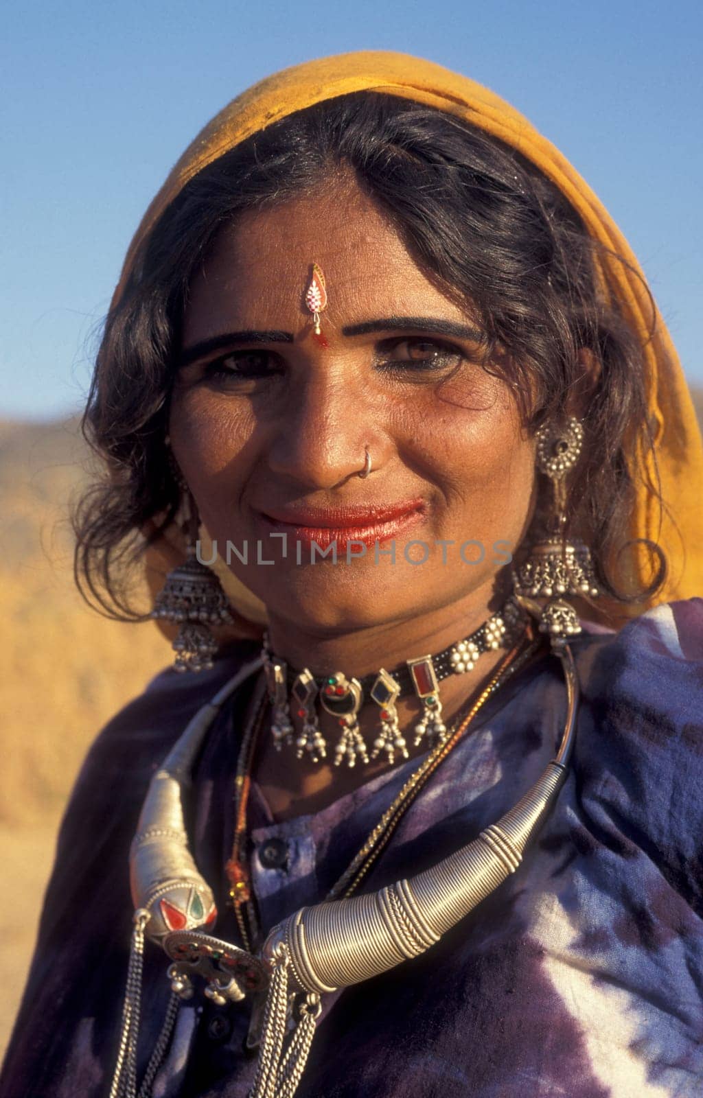 a portrait of a Rajasthani women in the Town of Jaisalmer in the Province of Rajasthan in India.  India, Jaisalmer, January, 1998