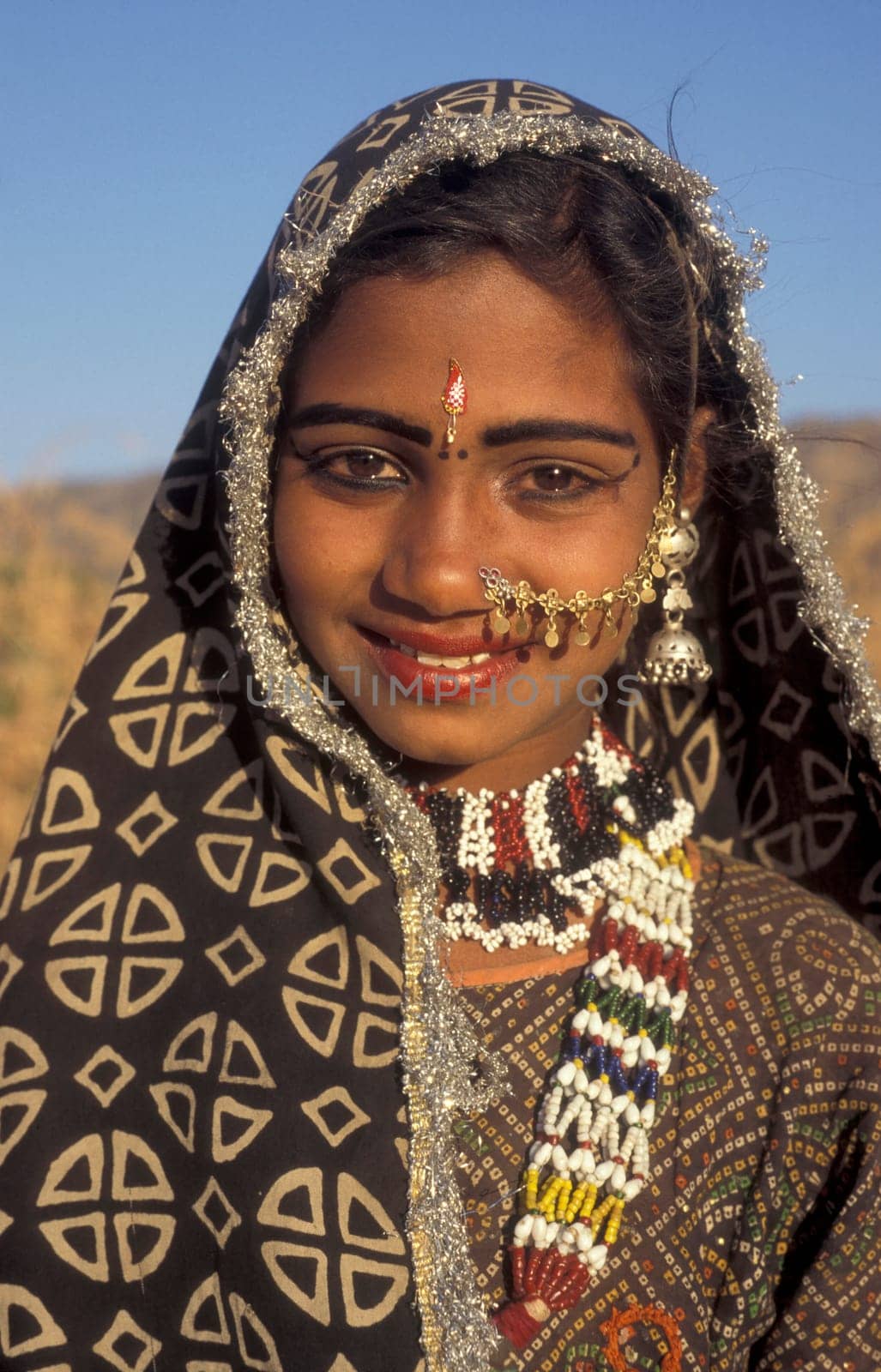 a portrait of a Rajasthani women in the Town of Jaisalmer in the Province of Rajasthan in India.  India, Jaisalmer, January, 1998