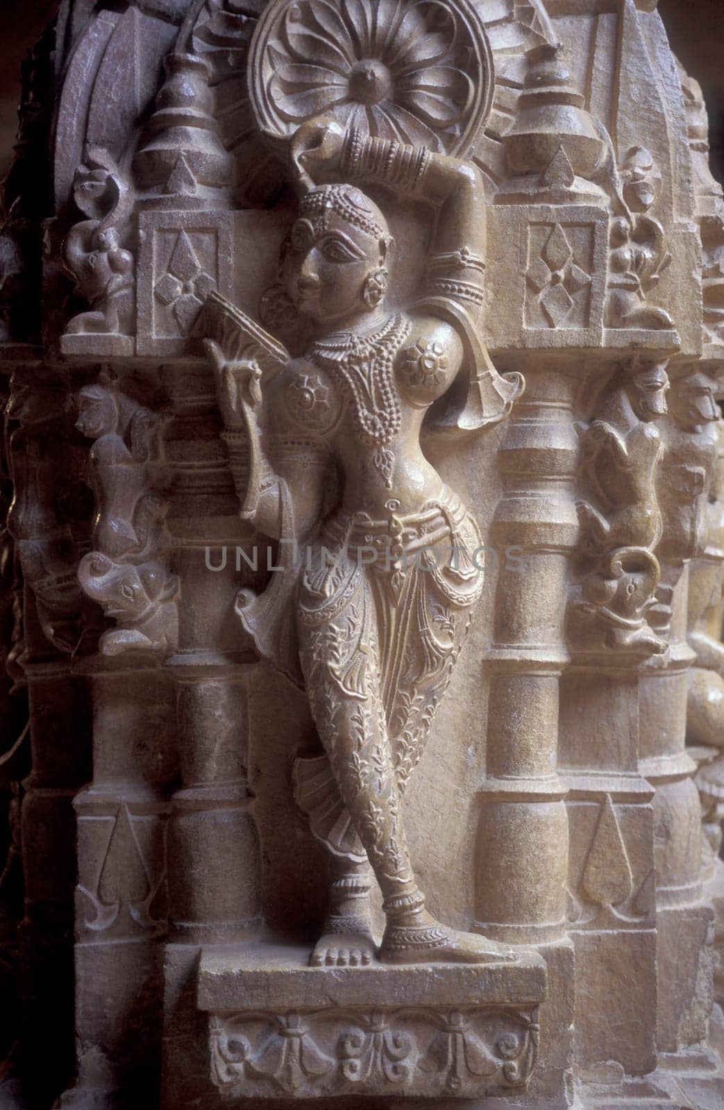 a stone carving figure inside oft the Jain Temple in the Jaisalmer Fort in the city of Jaisalmer in the Province of Rajasthan in India.  India, Jaisalmer, January, 1998