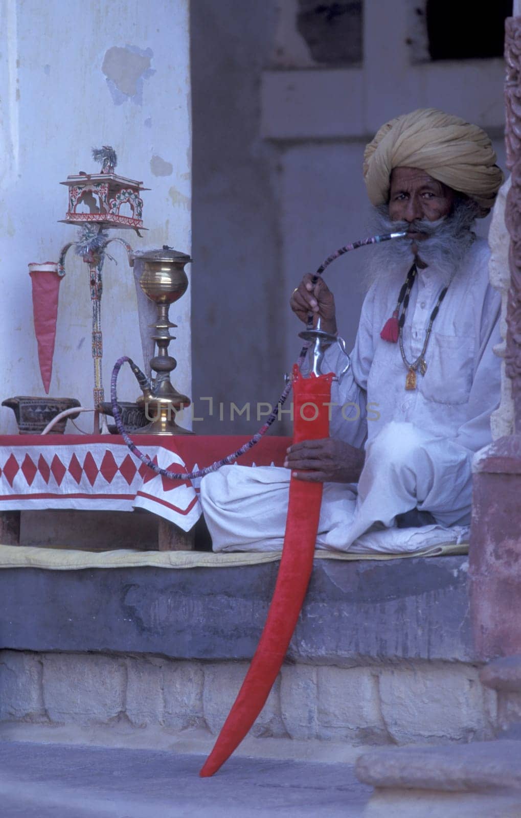 a portrait of a Rajasthani men in the Town of Jaisalmer in the Province of Rajasthan in India.  India, Jaisalmer, January, 1998