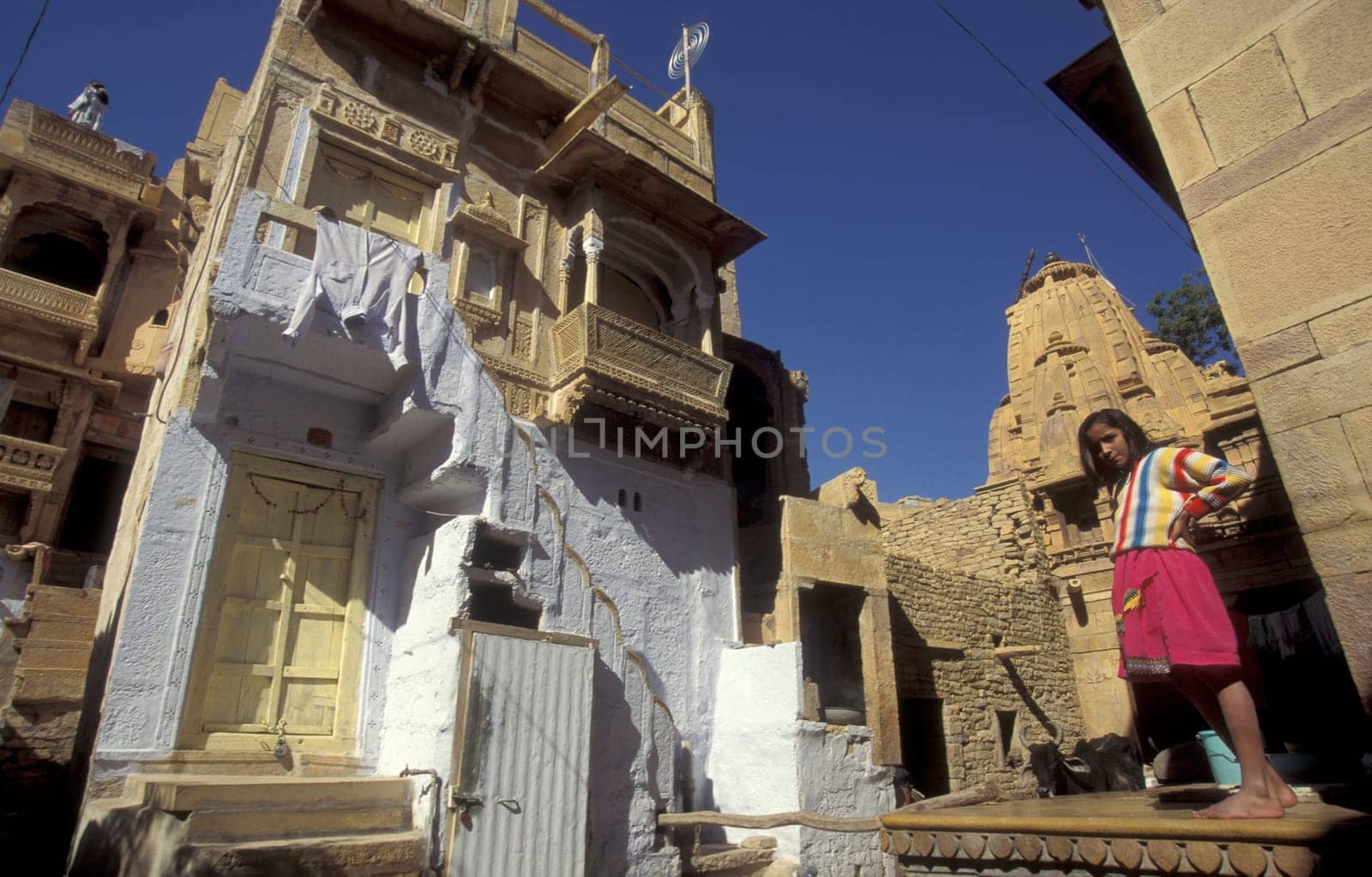 a Child is playing in the old Town in the Jaisalmer Fort with the city of Jaisalmer in the Province of Rajasthan in India.  India, Jaisalmer, January, 1998