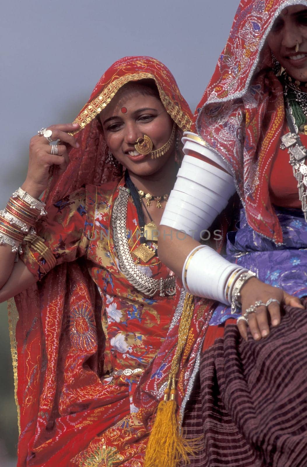 a portrait of a Rajasthani women in the Town of Jaisalmer in the Province of Rajasthan in India.  India, Jaisalmer, January, 1998