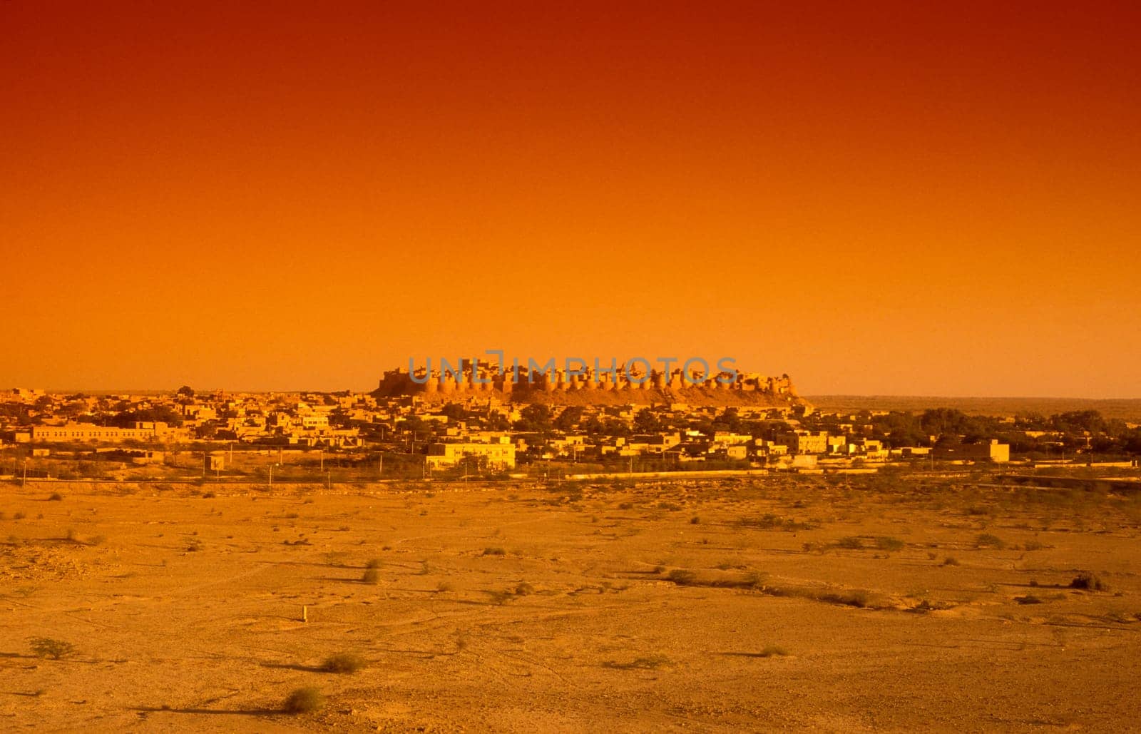 a view of the Jaisalmer Fort with the city of Jaisalmer in the Province of Rajasthan in India.  India, Jaisalmer, January, 1998