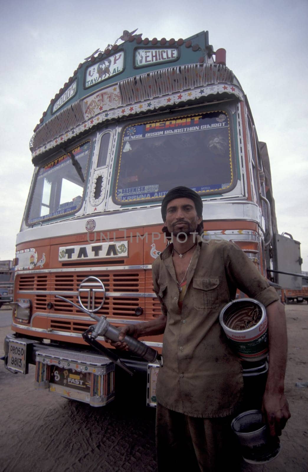 a public Bus driver at a Busstation in the Town of Jaisalmer in the Province of Rajasthan in India.  India, Jaisalmer, January, 1998