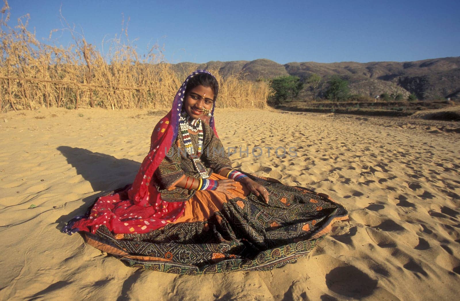 a portrait of a Rajasthani women in the Town of Jaisalmer in the Province of Rajasthan in India.  India, Jaisalmer, January, 1998