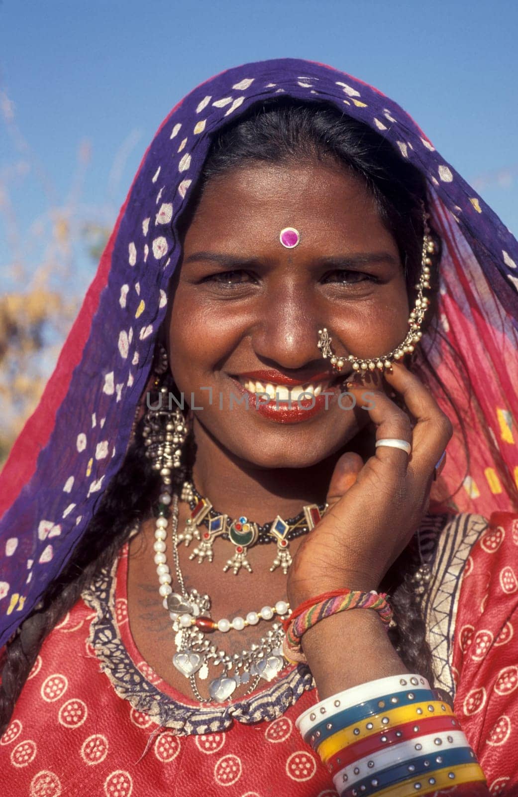 a portrait of a Rajasthani women in the Town of Jaisalmer in the Province of Rajasthan in India.  India, Jaisalmer, January, 1998