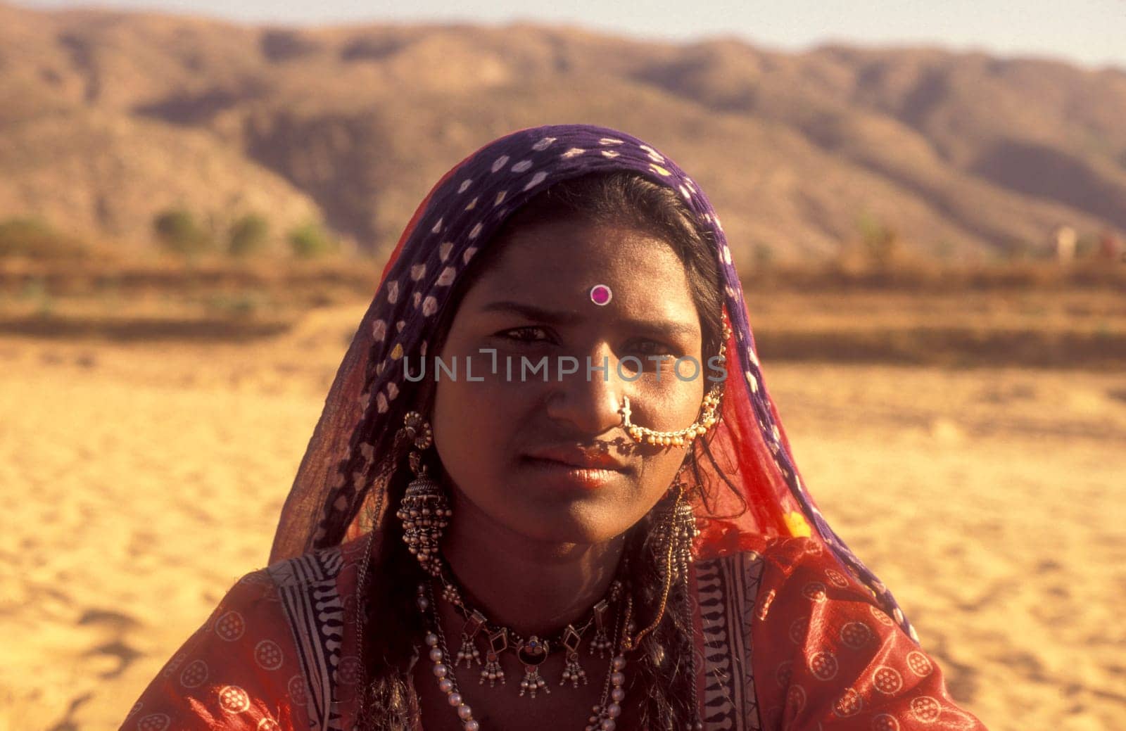 a portrait of a Rajasthani women in the Town of Jaisalmer in the Province of Rajasthan in India.  India, Jaisalmer, January, 1998
