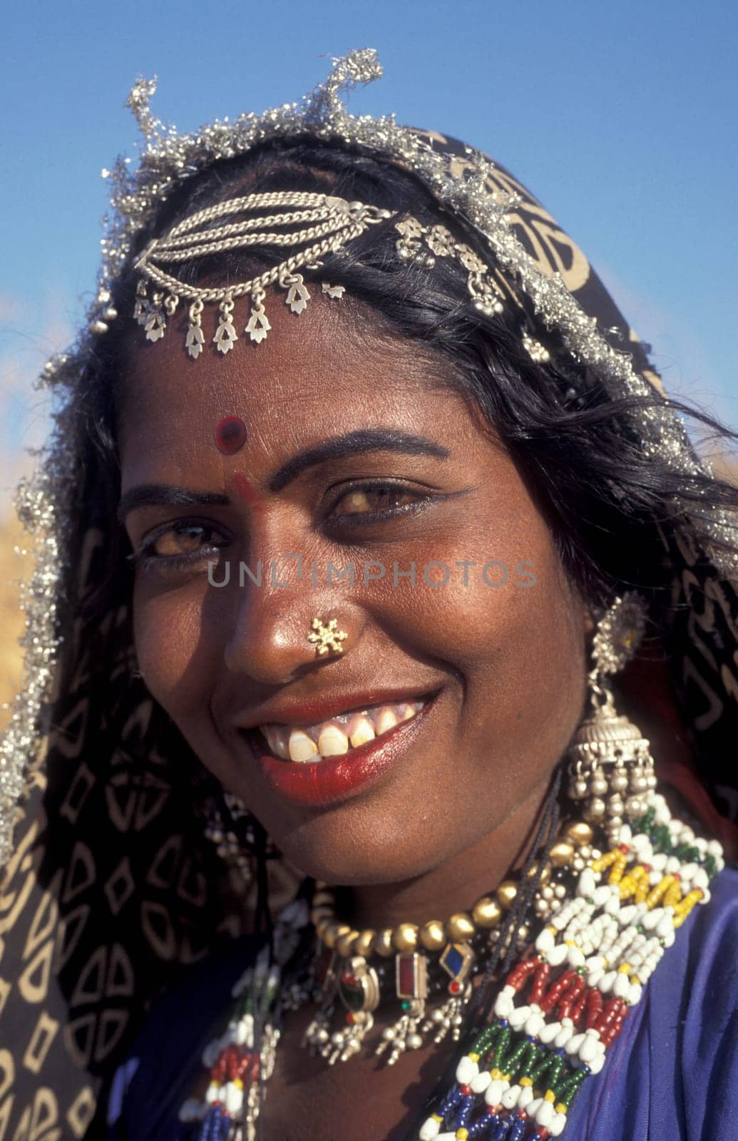a portrait of a Rajasthani women in the Town of Jaisalmer in the Province of Rajasthan in India.  India, Jaisalmer, January, 1998