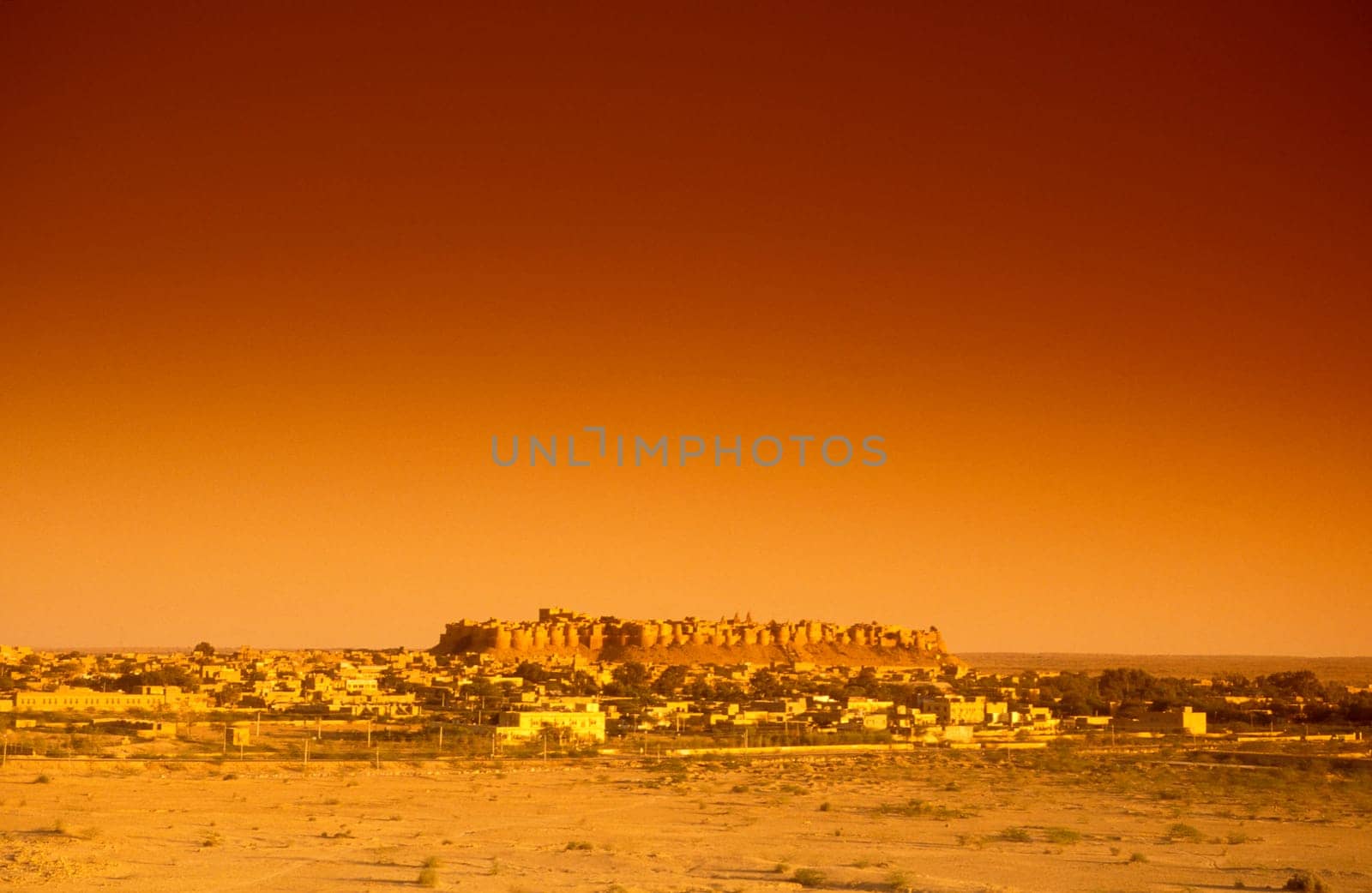 a view of the Jaisalmer Fort with the city of Jaisalmer in the Province of Rajasthan in India.  India, Jaisalmer, January, 1998