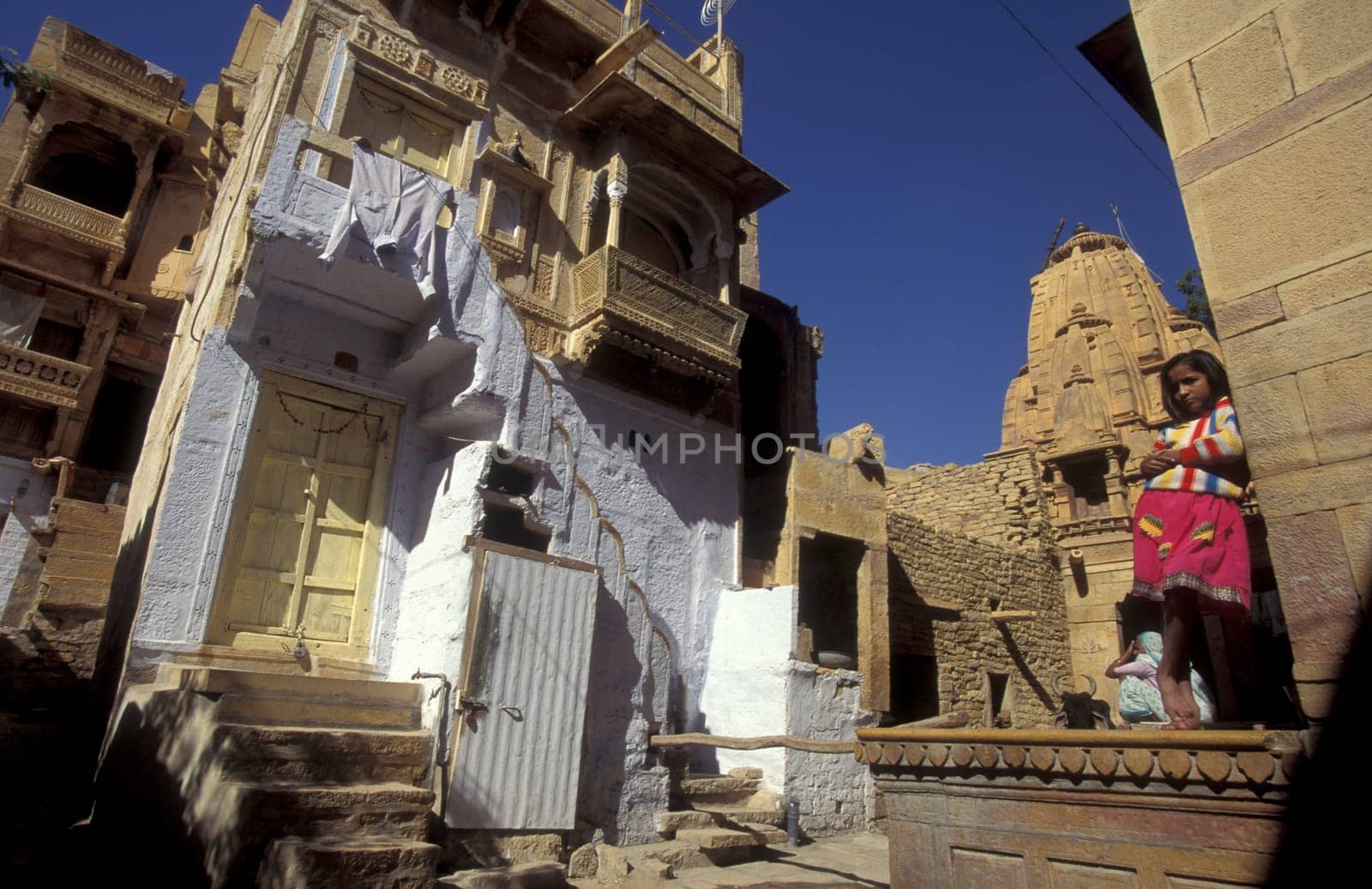 a Child is playing in the old Town in the Jaisalmer Fort with the city of Jaisalmer in the Province of Rajasthan in India.  India, Jaisalmer, January, 1998
