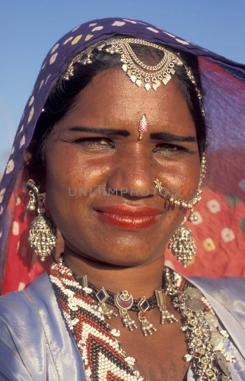 a portrait of a Rajasthani women in the Town of Jaisalmer in the Province of Rajasthan in India.  India, Jaisalmer, January, 1998