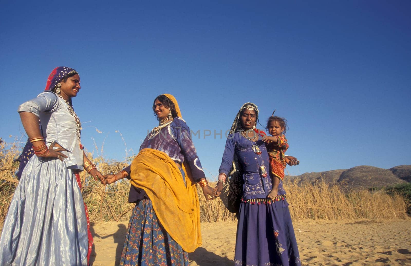 a portrait of a Rajasthani women with her Baby in the Town of Jaisalmer in the Province of Rajasthan in India.  India, Jaisalmer, January, 1998