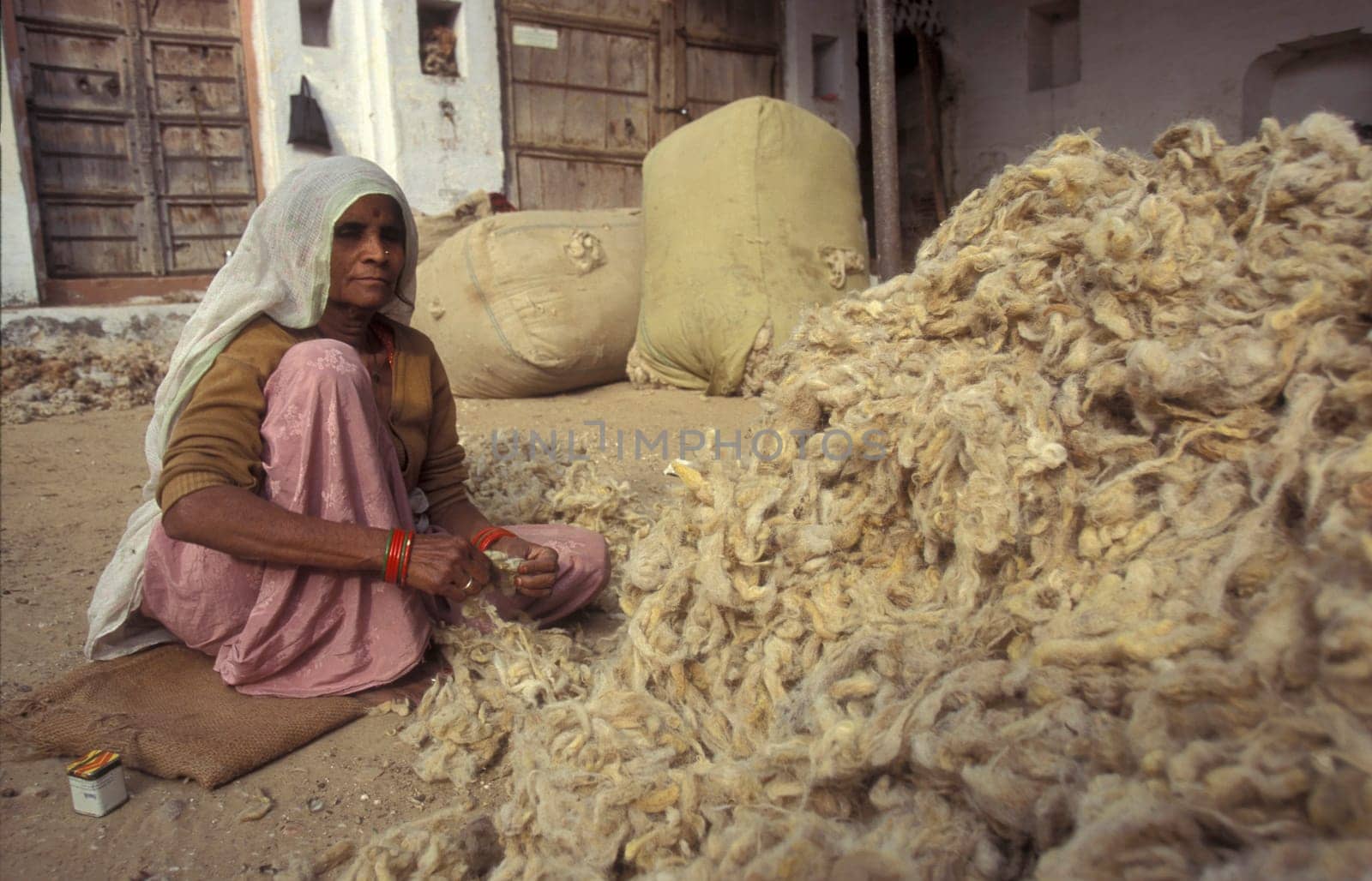 Working People in a Camel wool spinning Factory in the City of Jaisalmer in the Province of Rajasthan in India.  India, Jaisalmer, January, 1998