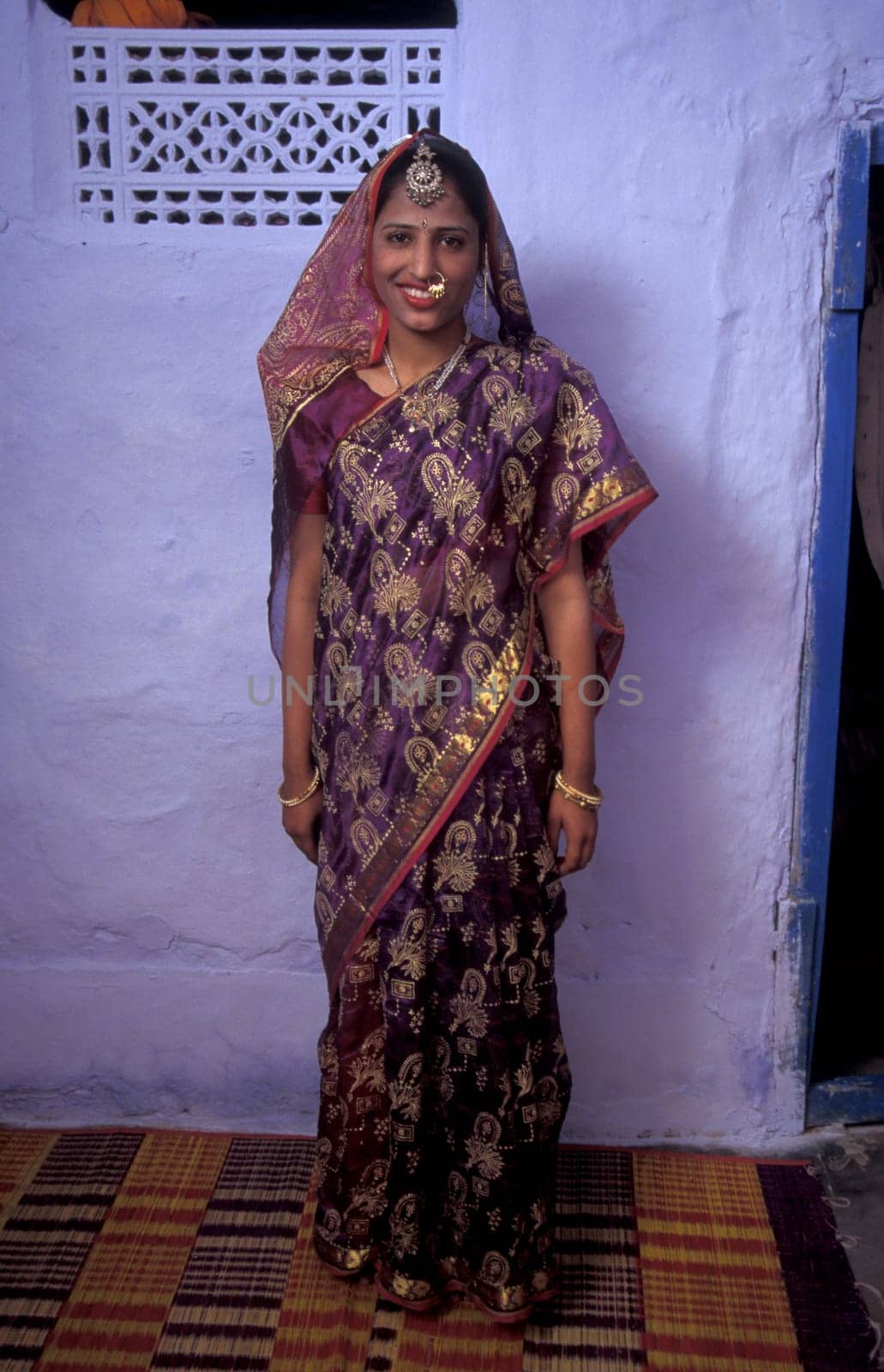 a portrait of a Rajasthani women in the Town of Jaisalmer in the Province of Rajasthan in India.  India, Jaisalmer, January, 1998