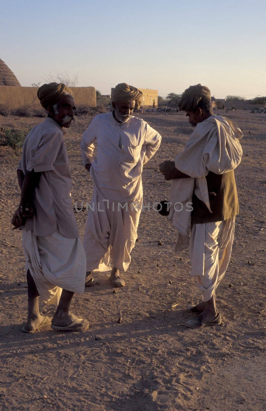 Old Rajasthani Men in a small Village near the Town of Bikaner in the Province of Rajasthan in India.  India, Bikaner, January, 1998