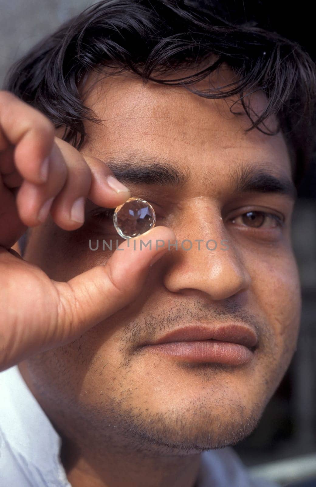 Working People in a Factory of gemstone cutting in the City of Jaipur in the Province of Rajasthan in India.  India, JAIPUR, January, 1998