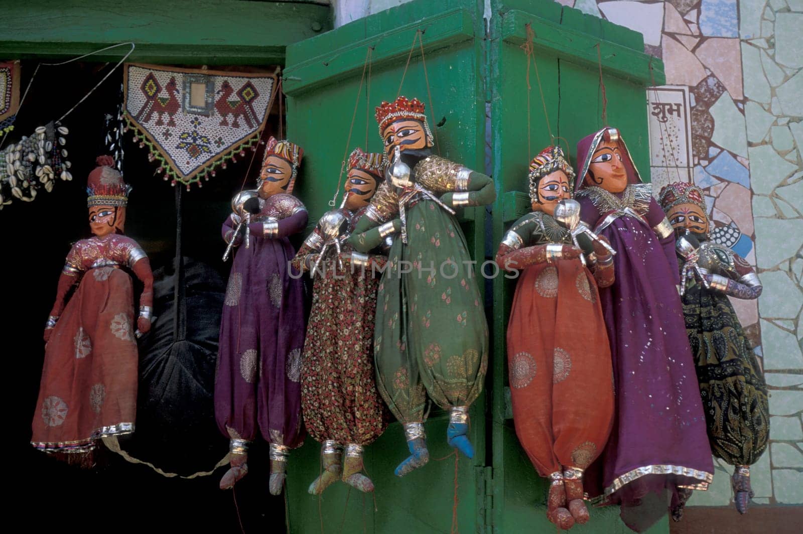 a indian Kitputli Dance Puppet figures shop in the City of Jaipur in the Province of Rajasthan in India.  India, Jaipur, January, 1998