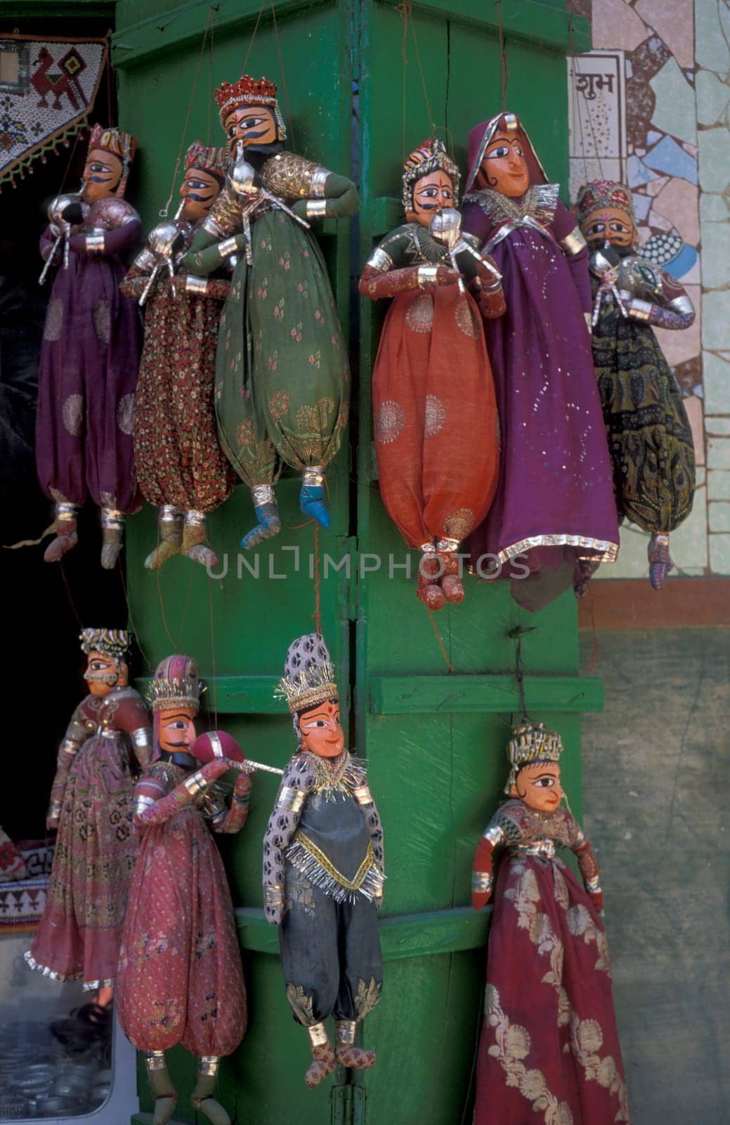 a indian Kitputli Dance Puppet figures shop in the City of Jaipur in the Province of Rajasthan in India.  India, Jaipur, January, 1998