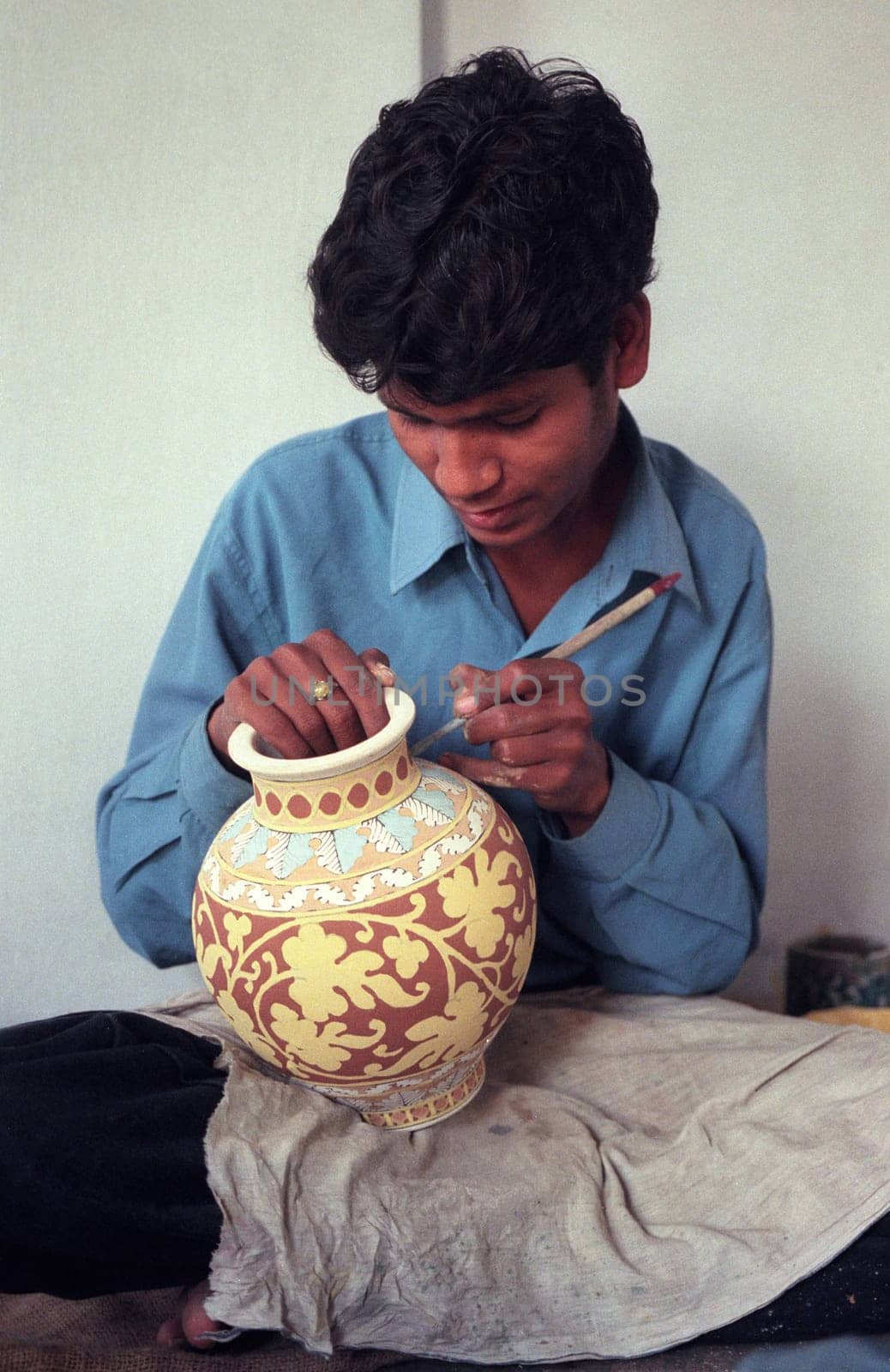 Working People in a Pottery Factory in the City of Jaipur in the Province of Rajasthan in India.  India, Jaipur, January, 1998
