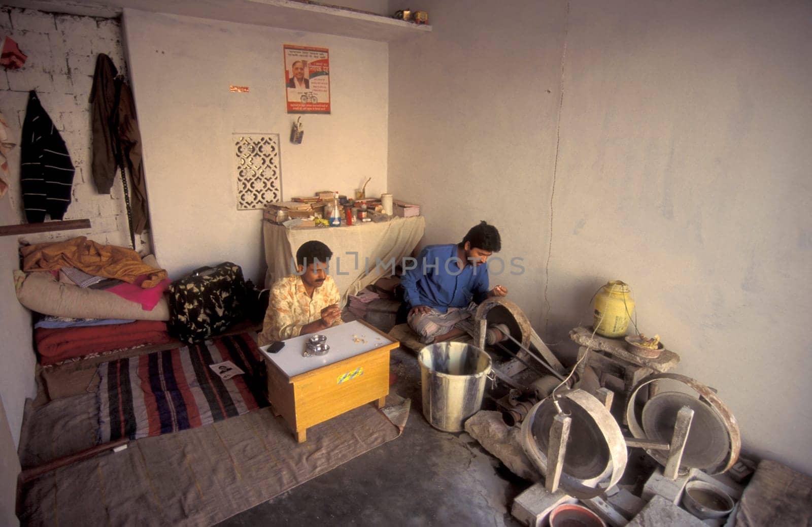 Working People in a Factory of gemstone cutting in the City of Jaipur in the Province of Rajasthan in India.  India, JAIPUR, January, 1998