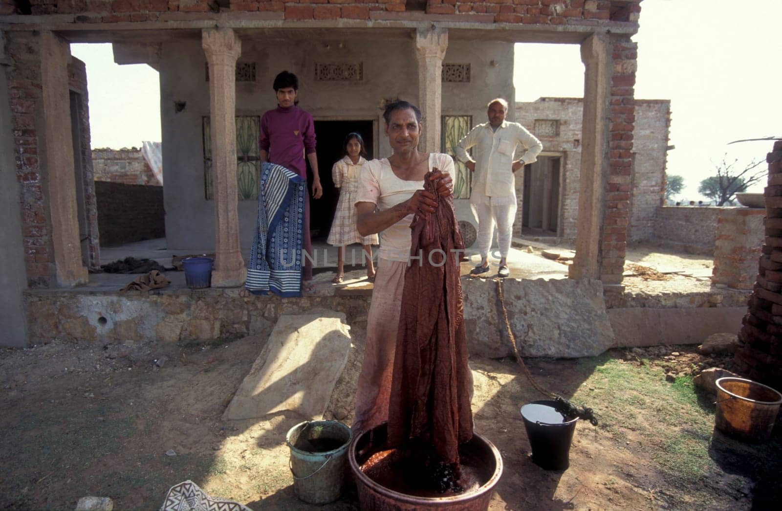 Working People in a textile coloring and dryeing Factory in the City of Jaipur in the Province of Rajasthan in India.  India, Jaipur, January, 1998