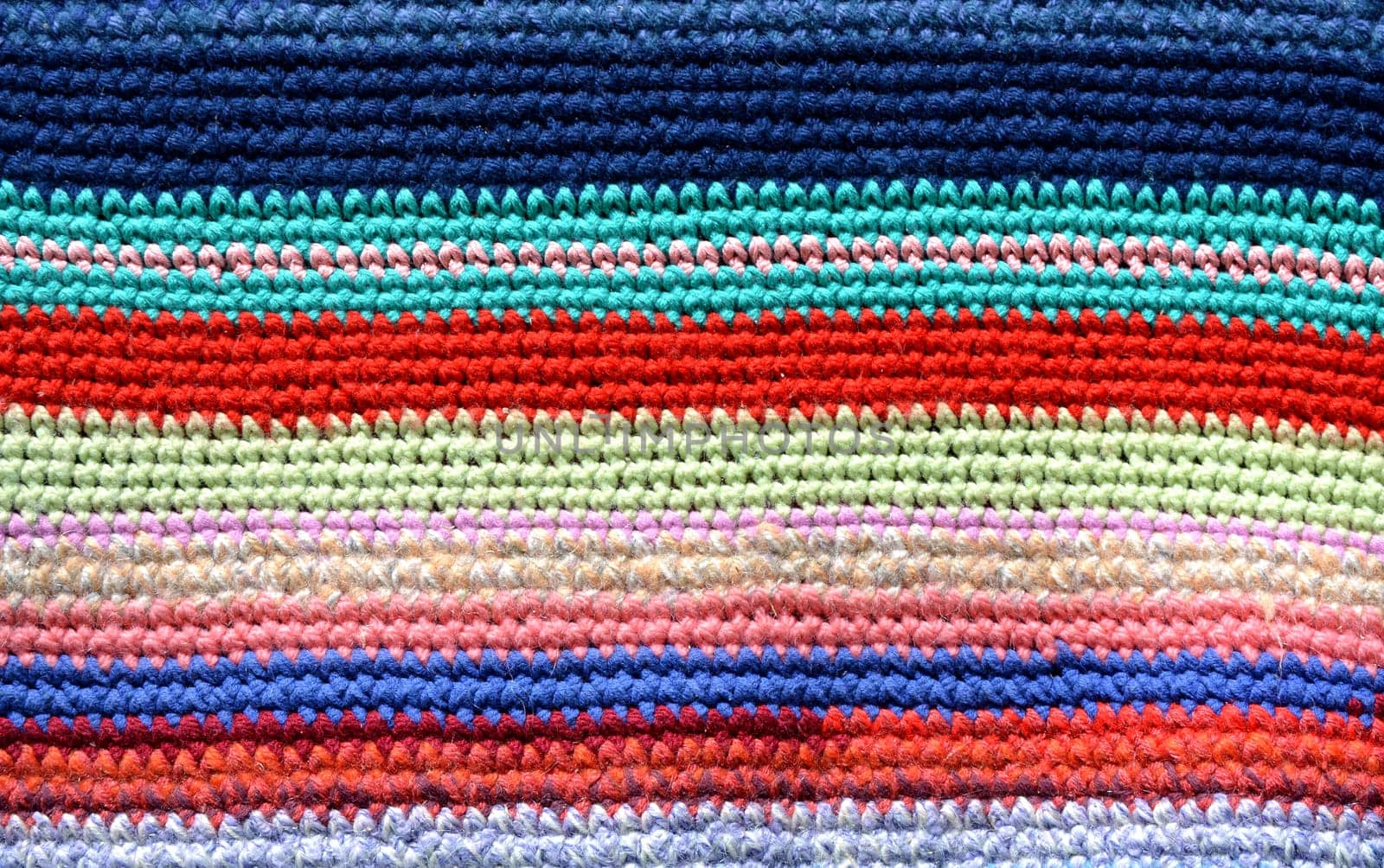 Knitted and colored stripes Handmade carpet. Cozy background