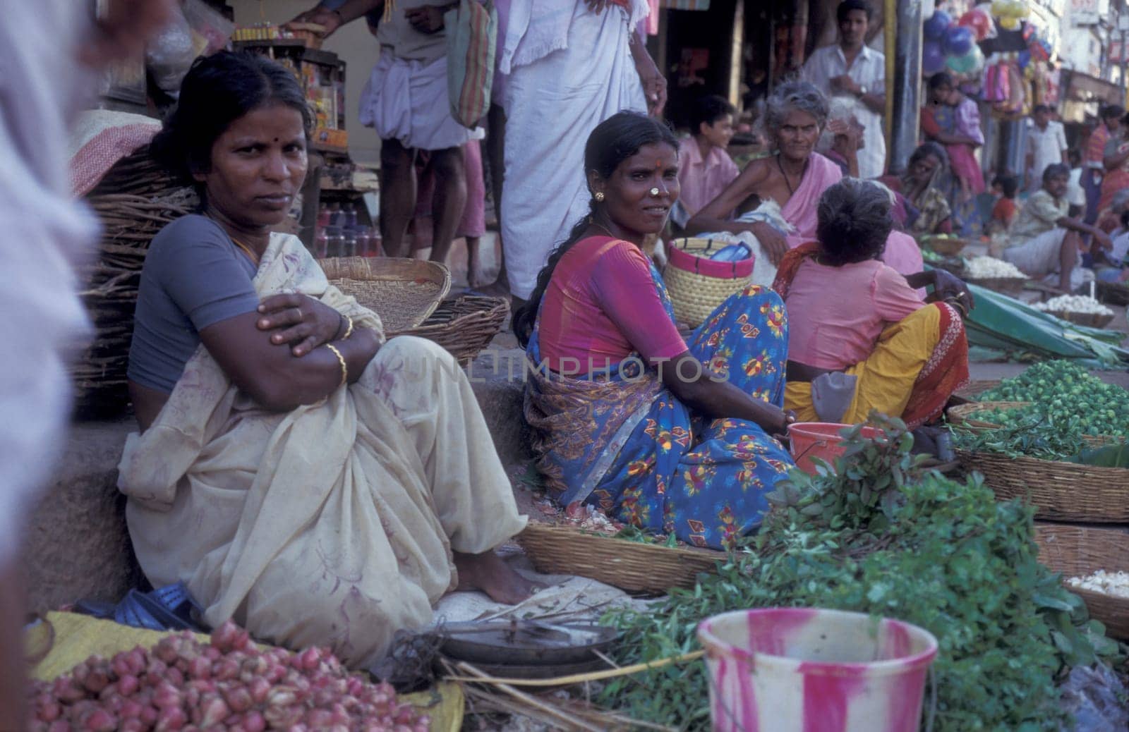 People at Streetmarket and alley in the city of Chennai in Province Tamil Nadu in India.  India, Chennai, April, 1998